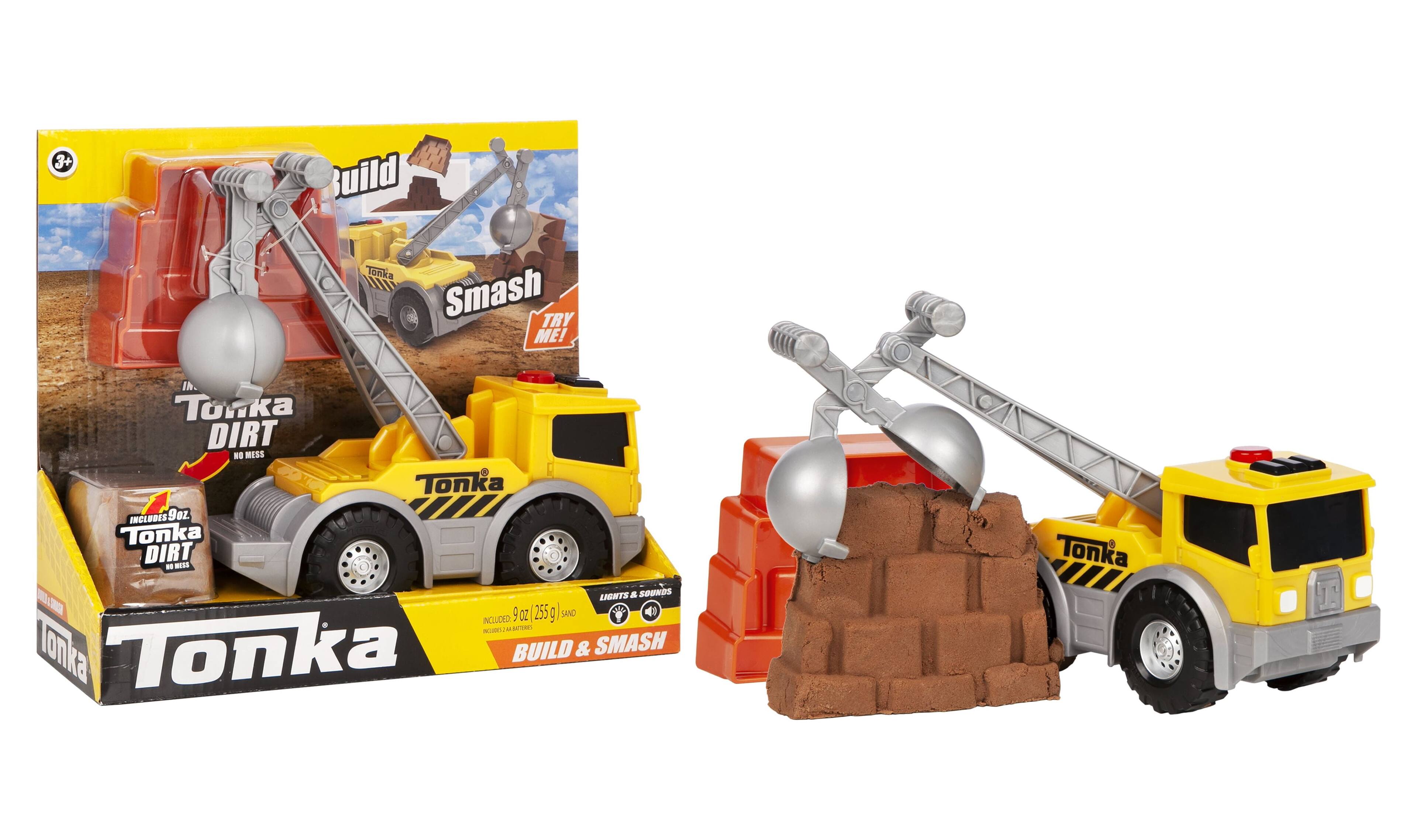 Sure, here is the corrected and grouped text from the image:

---

**Tonka**

**Build & Smash**

**TRY ME!**

**Tonka DIRT - NO MESS**

**INCLUDES 9oz. (255g) SAND**

**LIGHTS & SOUNDS INCLUDED**

**BUILD & SMASH**

**Tonka**

---

This text is taken from the packaging and the toy itself.