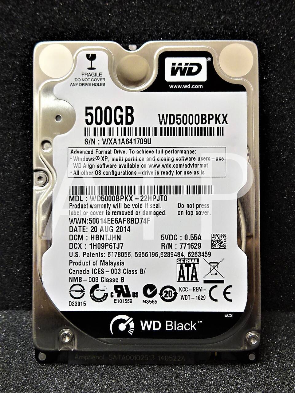 FRAGILE DO NOT COVER ANY DRIVE HOLES  
WD www.wd.com  
500GB WD5000BPKX  
S/N: WXA1A641709U  
Advanced Format Drive. To achieve full performance:  
- Windows XP, multi partition and cloning software users use WD Align software available on www.wdc.com/advformat  
- All other OS configurations - drive is ready for use as is  

MDL: WD5000BPKX-22HPJTO  
Product warranty will be void if seal, label or cover is removed or damaged.  
Do not press on top cover.  

WWN: 50014EE6AF8BD74F  
DATE: 20 AUG 2014  
DCM: HBNTJHN  
DCX: 1H09P6TJ7  
R/N: 771629  

U.S. Patents: 6178056, 5956196, 6289484, 6263459  
Product of Malaysia  
Canada ICES-003 Class B/  
