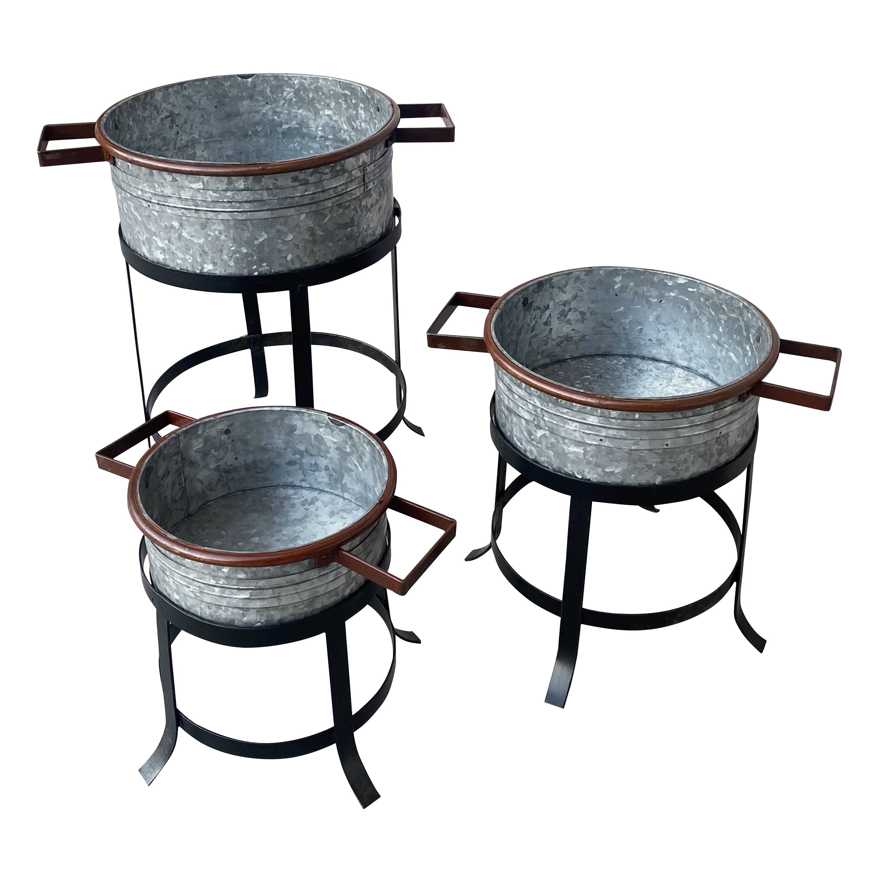 Left. Manhattan Lane - 21, 18, and 16 Inch 3 Piece Round Tub Metal Planter Set with Stand in Galvanized Gray and Black Iron - Gray and Black.