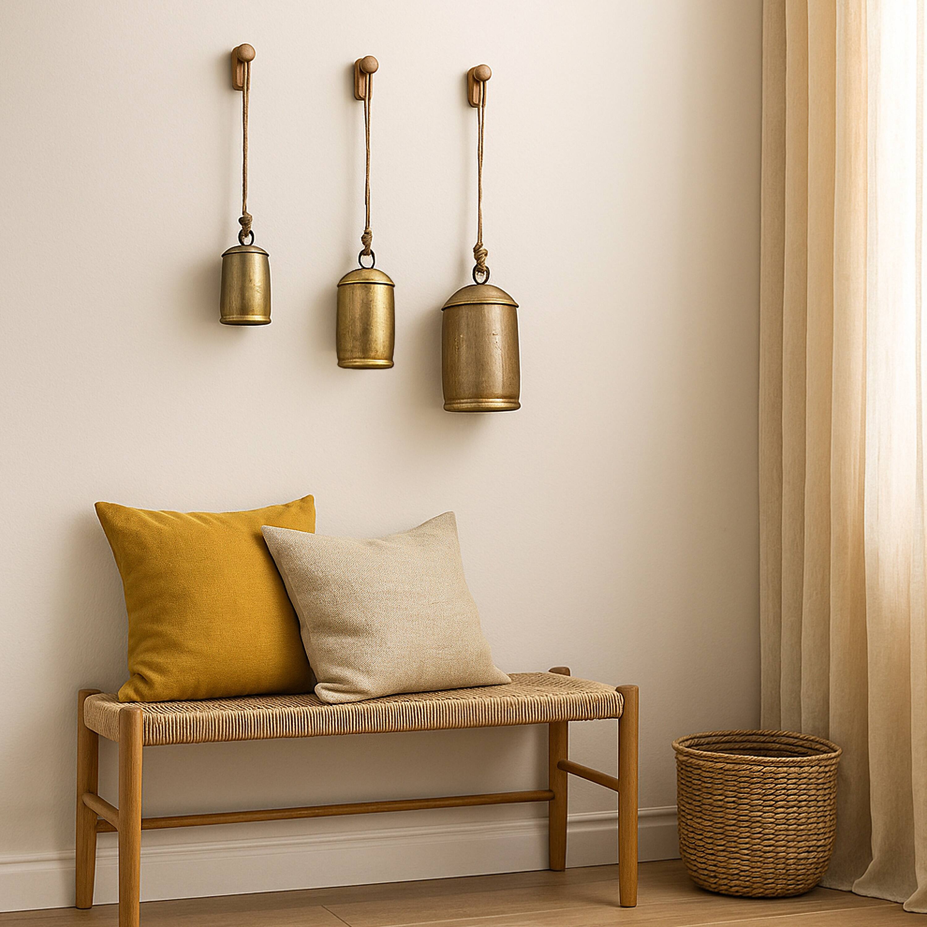 Alt View 6. Manhattan Lane - Zaira Decorative Iron Cow Bells Set of 3 | Cylindrical | Antique Gold Finish| Jute Hanging Rope | 20, 15, 12 Inches - Gold.