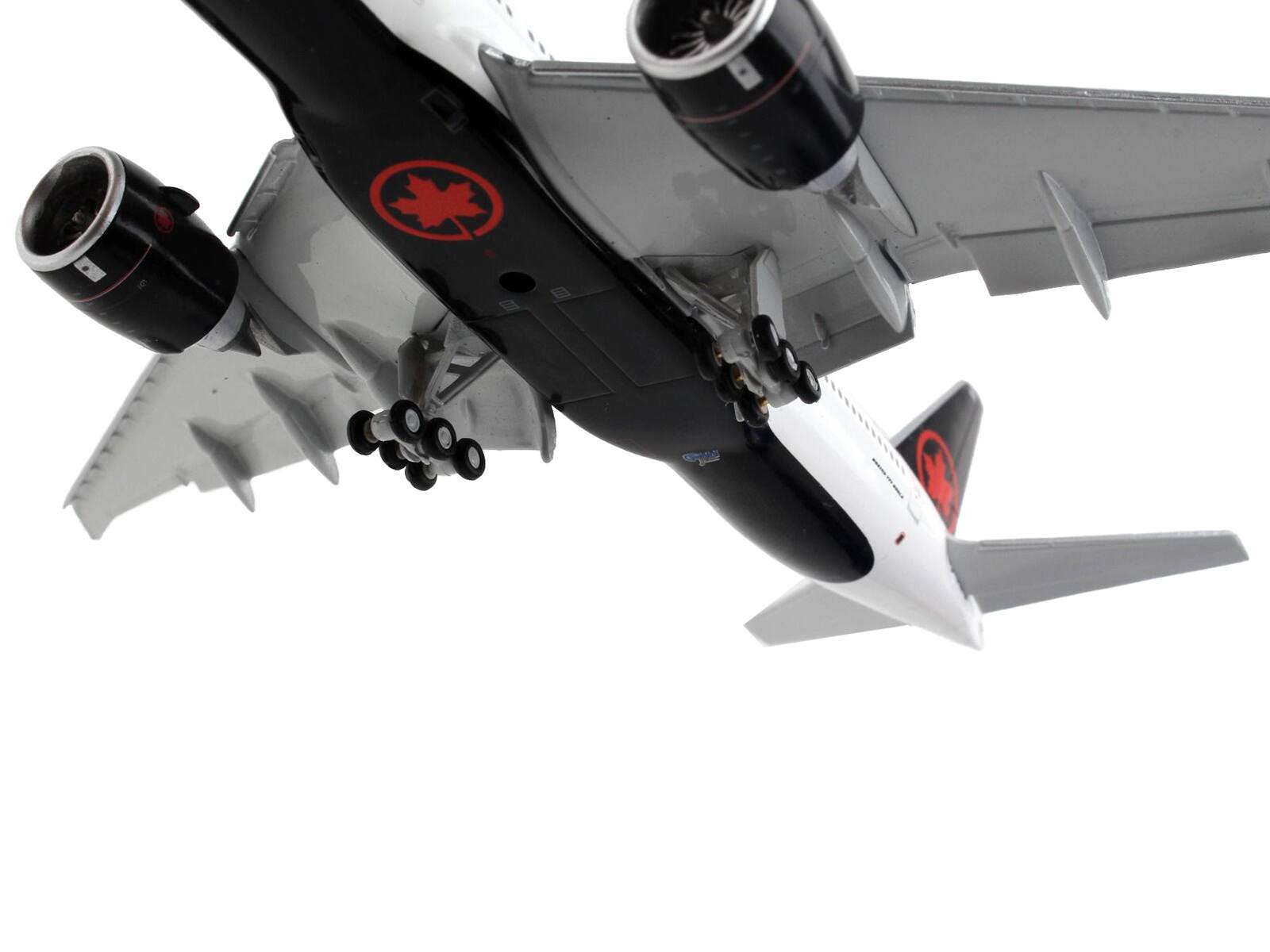 Left. GeminiJets - Boeing 777-200LR Commercial Aircraft with Flaps Down Air Canada White with Black Tail 1/400 Diecast Model Airplane - White with Black.