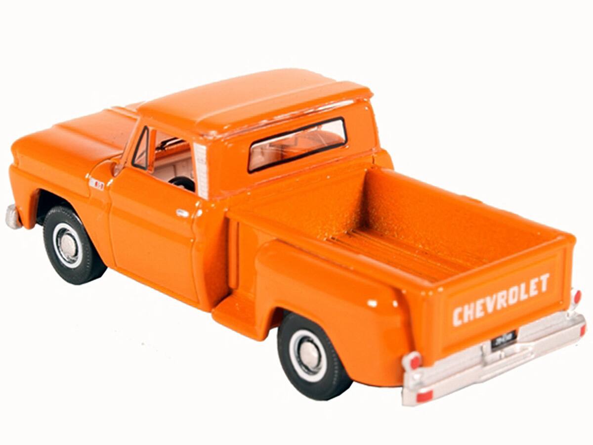 Left. Oxford Diecast - 1965 Chevrolet C10 Stepside Pickup Truck Orange 1/87 (HO) Scale Diecast Model Car by Oxford Diecast - Orange.