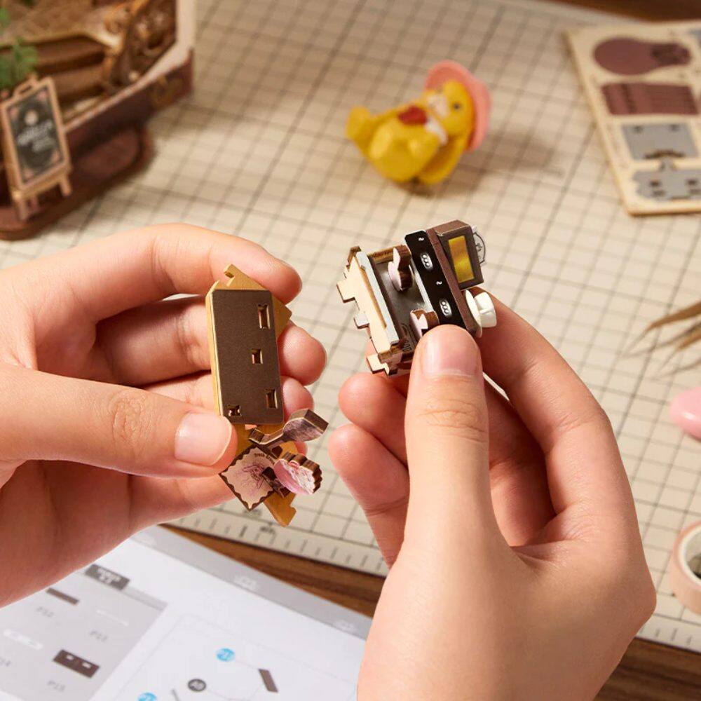 Left. 3D Puzzle - DIY 3D Book Nook Kit: Holiday Cafe 171 pieces.