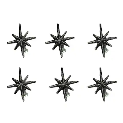 The image shows six black star-shaped decorations arranged in two rows of three.