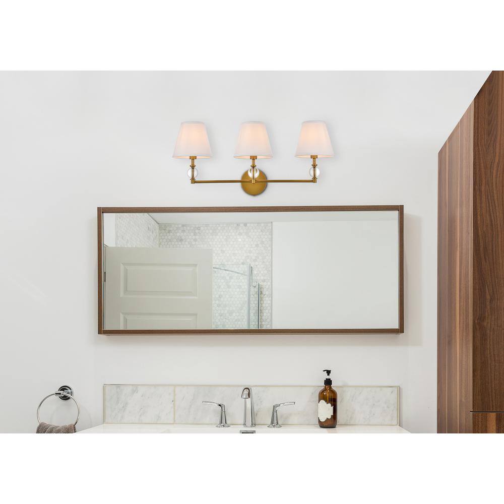 Angle. Living District - Bethany 3 lights bath sconce in brass with white fabric shade - Brass And White Fabric Shade.