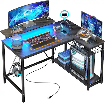 Front. Bestier - L-Shaped Gaming Desk with Power Outlets LED Lights and Reversible Storage Shelves & Hooks - 42" Wide - Black Carbon Fiber.