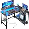 Bestier - L-Shaped Gaming Desk with Power Outlets LED Lights and Reversible Storage Shelves & Hooks - 42" Wide - Black Carbon Fiber