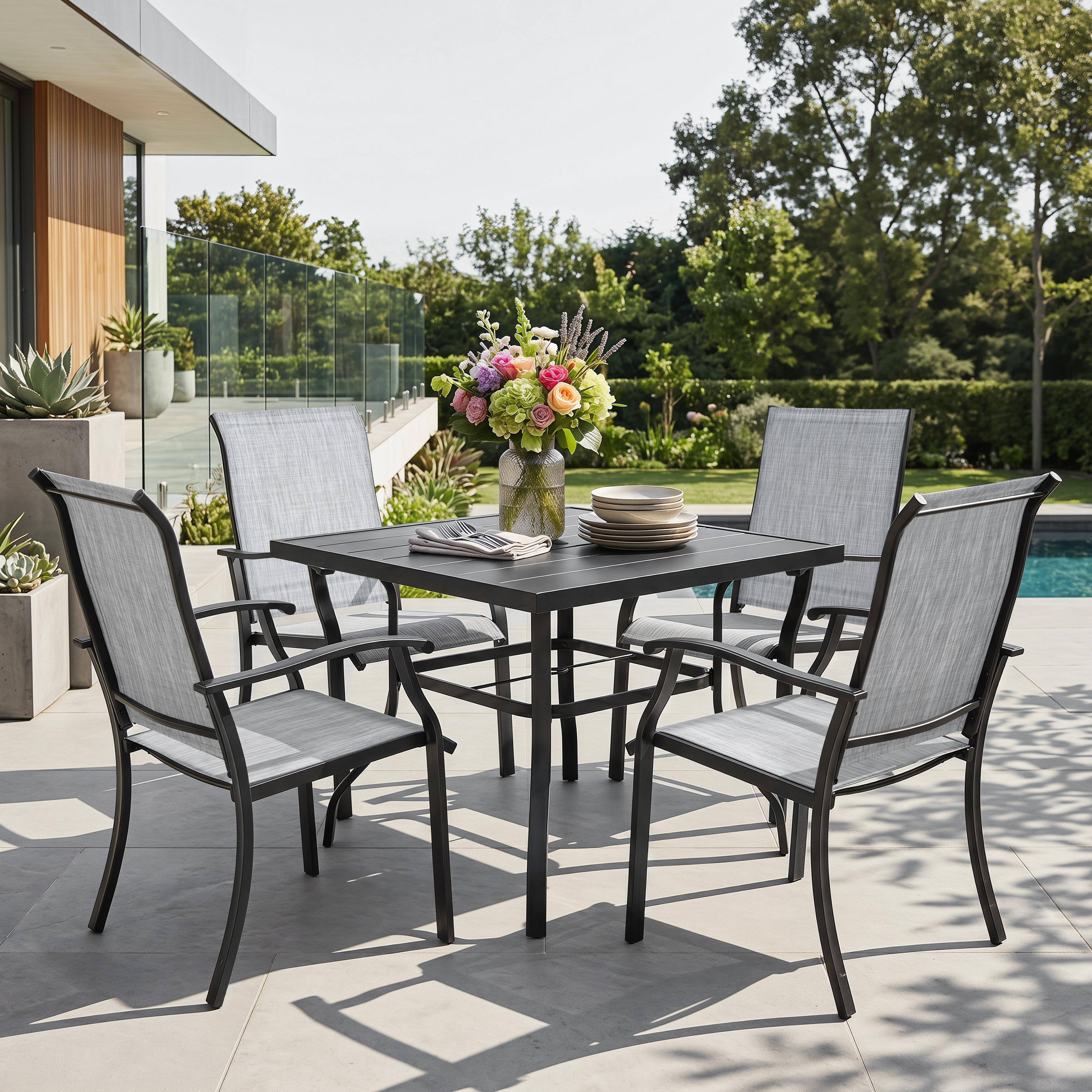 Angle. Nuu Garden - 5-Piece Patio Textilene Dining Set with Umbrella Hole, Powder Coating - Black and Gray.