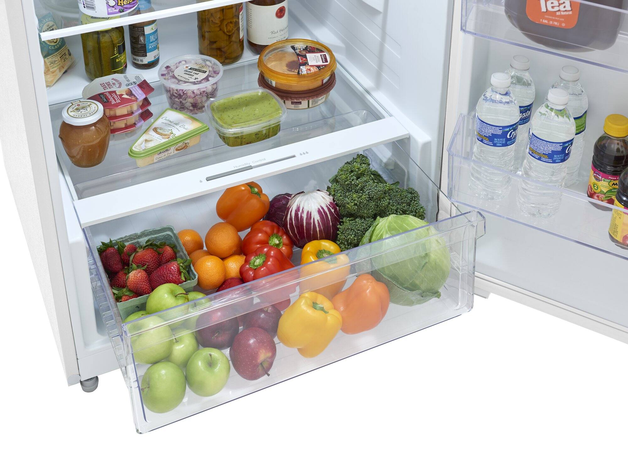 The image shows a refrigerator with its door open, revealing a variety of fruits and vegetables stored inside. There are several apples, oranges, and broccoli visible in the refrigerator. The apples are placed in different sections of the refrigerator, with some on the left side, some in the middle, and others on the right side. The oranges are also scattered throughout the refrigerator, with some located near the apples and others closer to the broccoli. The broccoli is placed in the middle of the refrigerator, surrounded by the apples and oranges. The refrigerator is well-stocked with a diverse assortment of fresh produce.