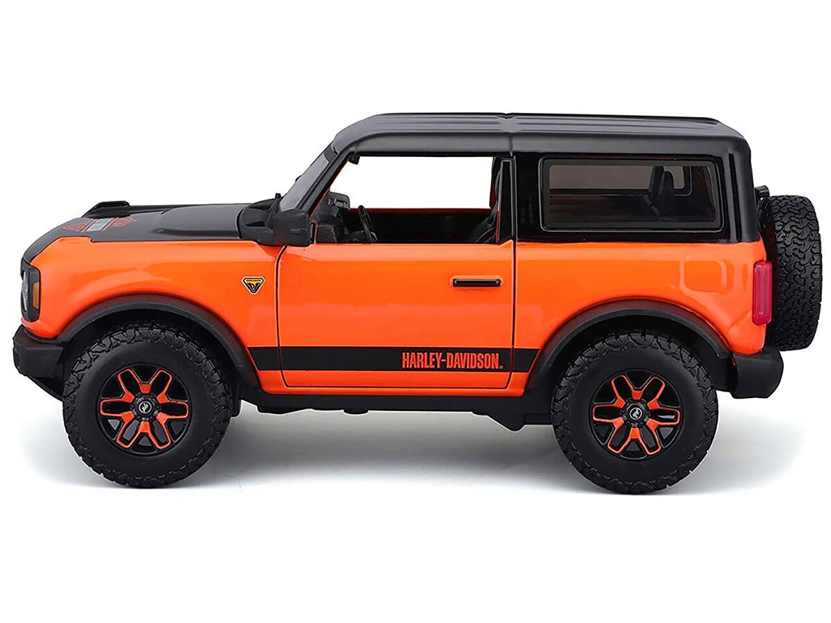 Left. Maisto - 2021 Ford Bronco Badlands Orange and Black "Harley Davidson" "H-D Custom" Series 1/24 Diecast Model Car by Maisto - Orange And Black.