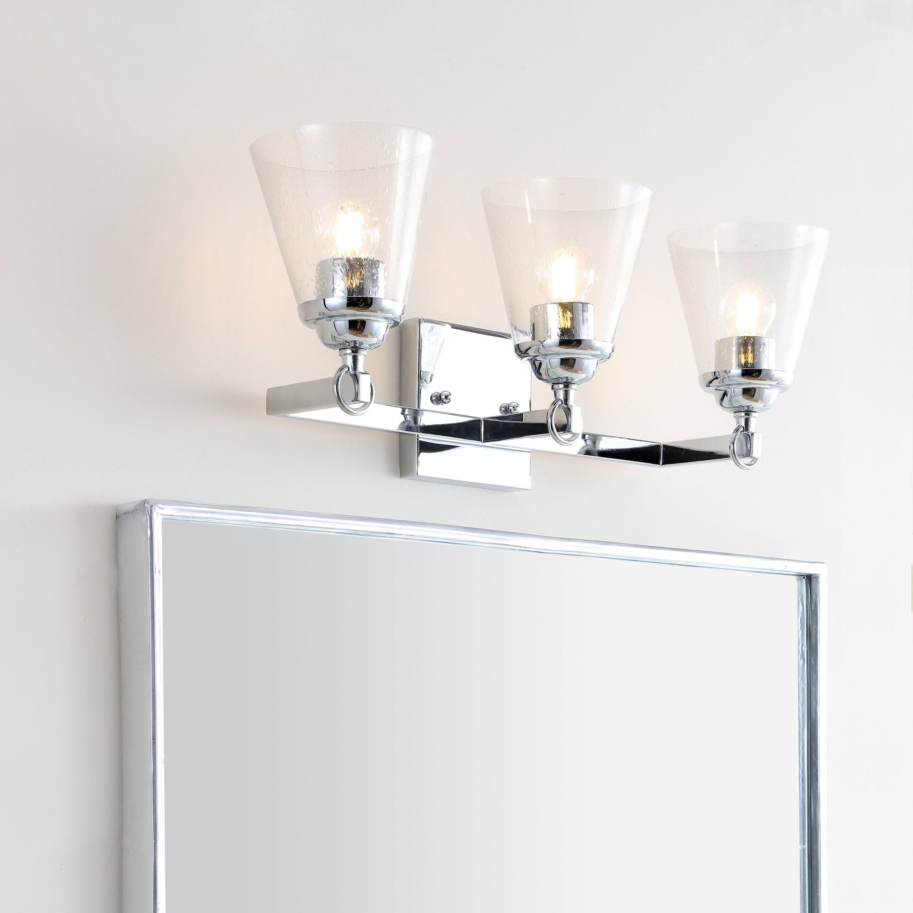 Alt View 1. Jonathan Y - Marion 21" 3-Light Hurricane Metal/Seeded Glass LED Vanity Light, Chrome - Chrome / Clear.
