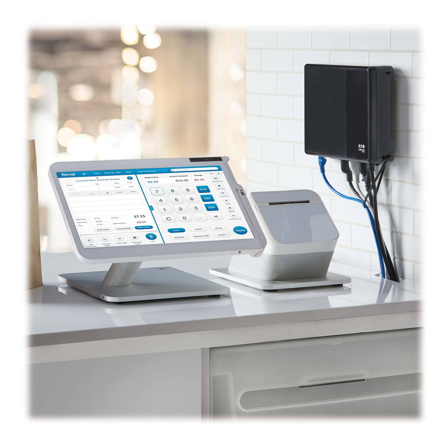 Sure, here is the corrected and grouped text from the image:

---

**Revolution POS**

**Customer Receipt Printer**

**Total** $7.25

**Cash** $10.00

**Change** $2.75

**Items**

1. Item 1 $5.00
2. Item 2 $2.25

**Buttons**

- Cancel
- Print
- Scan
- Gift Card
- Credit Card
- Check
- Cash
- Discount
- Tax
- Subtotal
- Total
- Clear
- Enter

**Payment Options**

- Cash
- Credit Card
- Check
- Gift Card

**Other**

- Settings
- Reports
- Help

---

This text is based on the visible elements and layout of the POS system in the image.