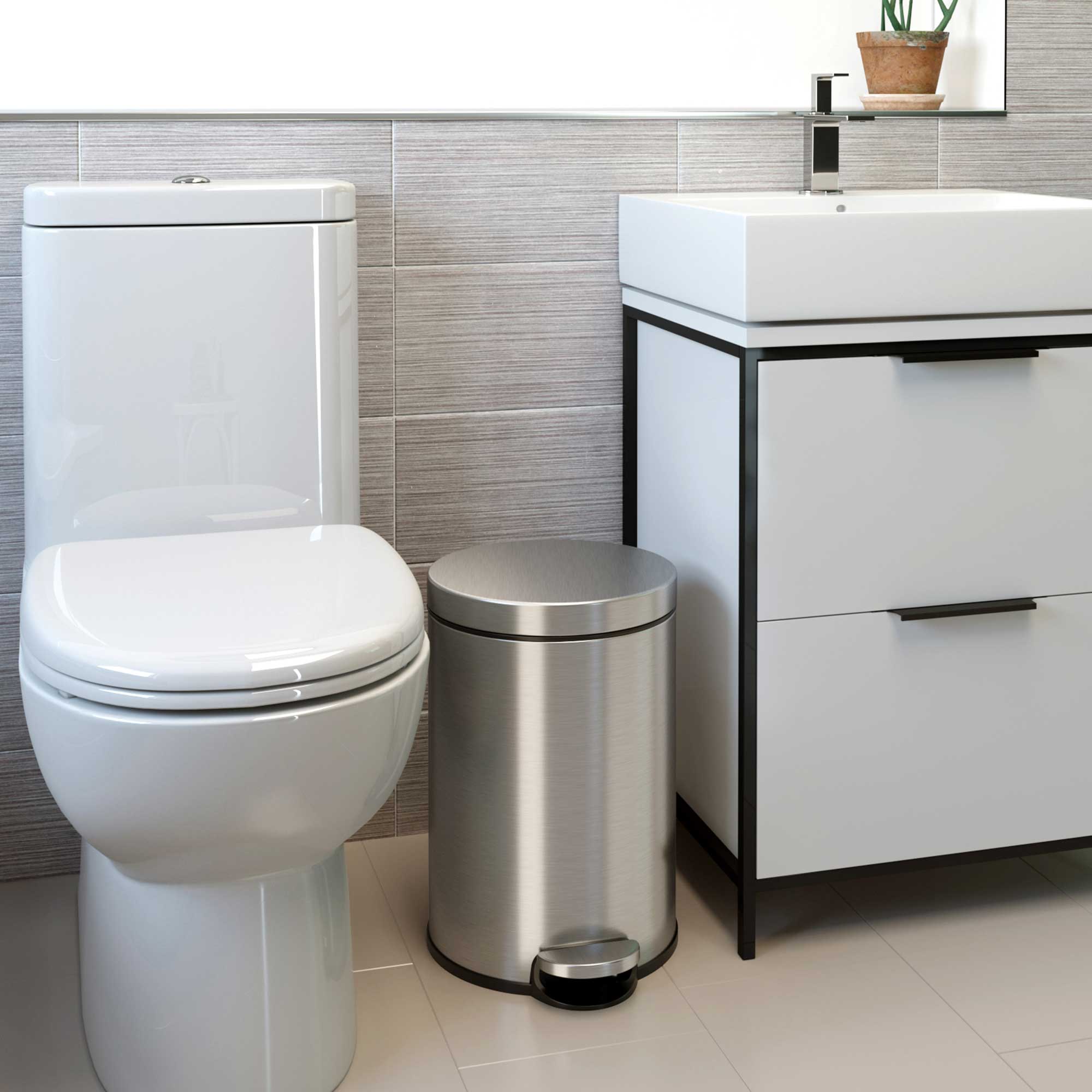 Angle. iTouchless - 3.2 Gallon SoftStep Round Stainless Steel Step Bathroom Trash Can with AbsorbX Odor Filter - Silver.