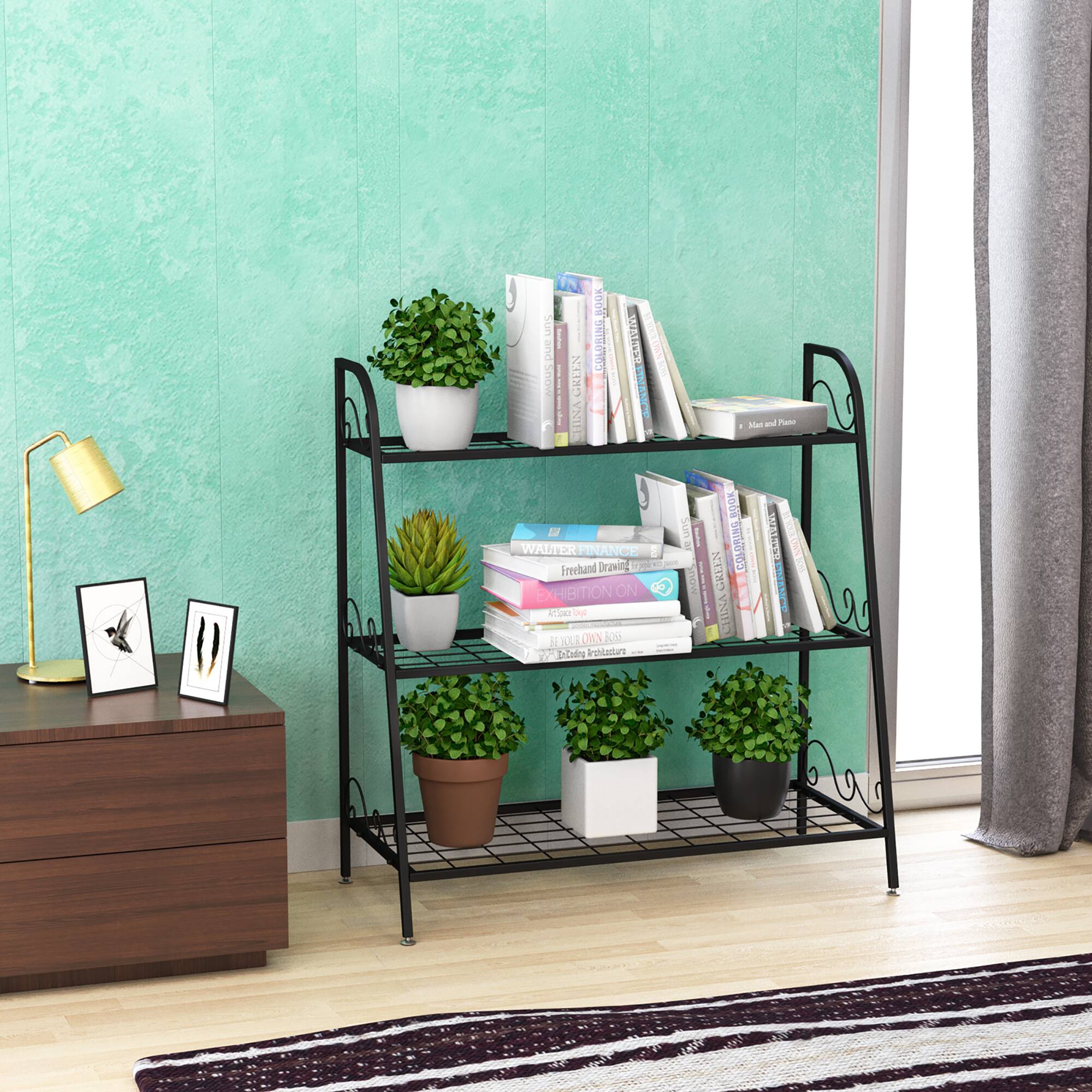 A shelf with a potted plant and books on it.