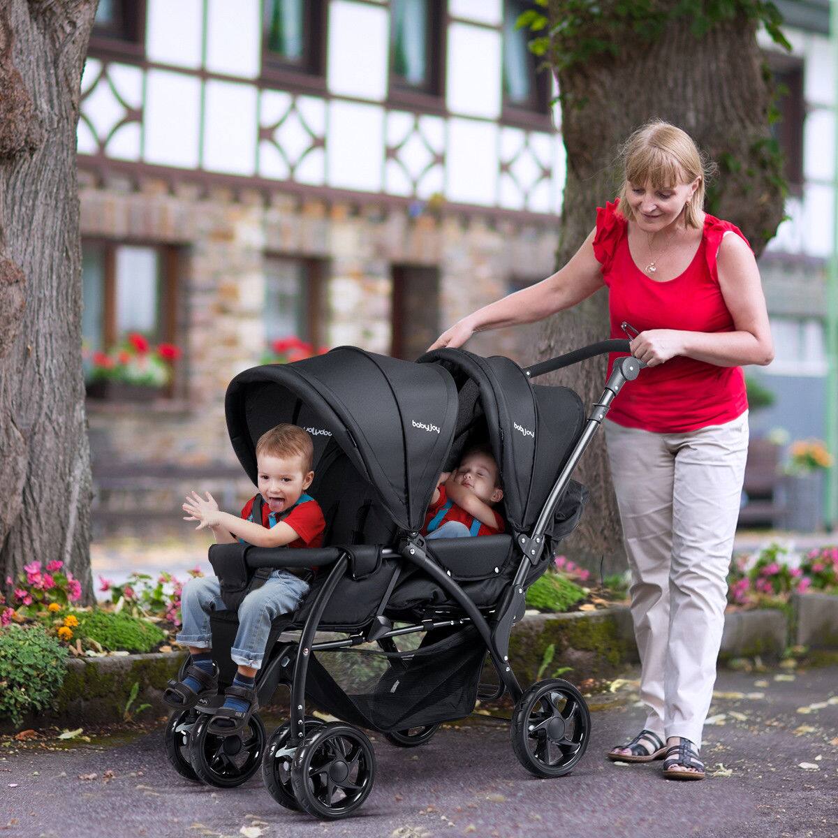 The text on the stroller reads "babyjoy".