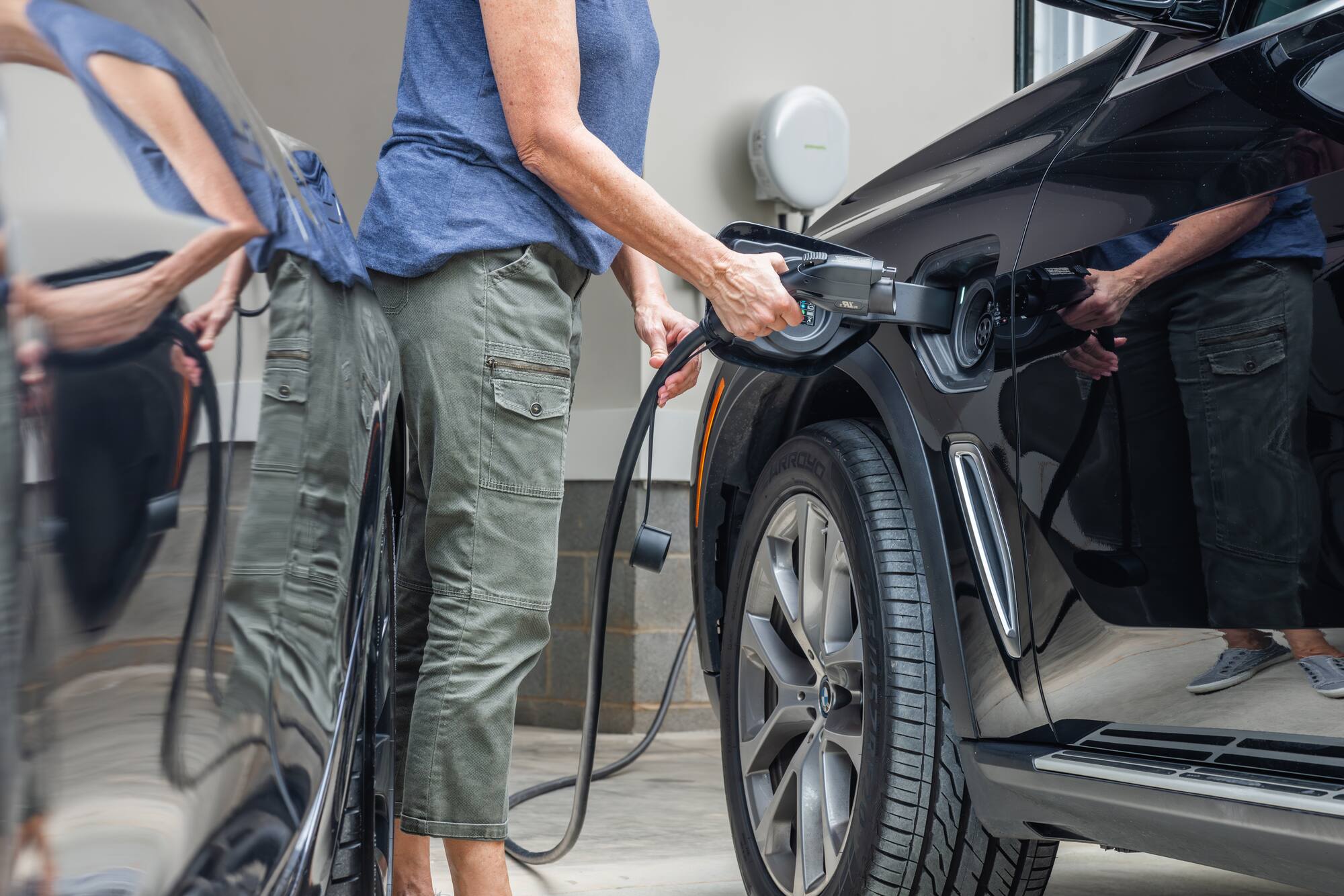 I'm sorry, but the text "9 RRCHE CASTH" does not make sense and does not seem to be related to the image. The image shows a person pumping gas into a car, and there is no indication of the text "9 RRCHE CASTH" in the image.