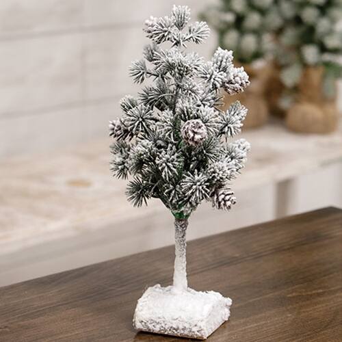 Angle. BreeBe - Flocked Bristle Pine Tree w/Cones on Log 9" - Multicolor.
