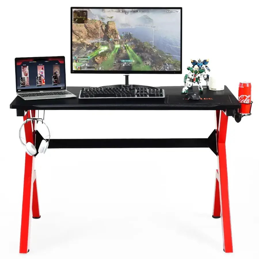 I have a desktop computer with a monitor, keyboard, and mouse. There is also a laptop on the desk. Additionally, there is a Coca-Cola can and a cell phone.