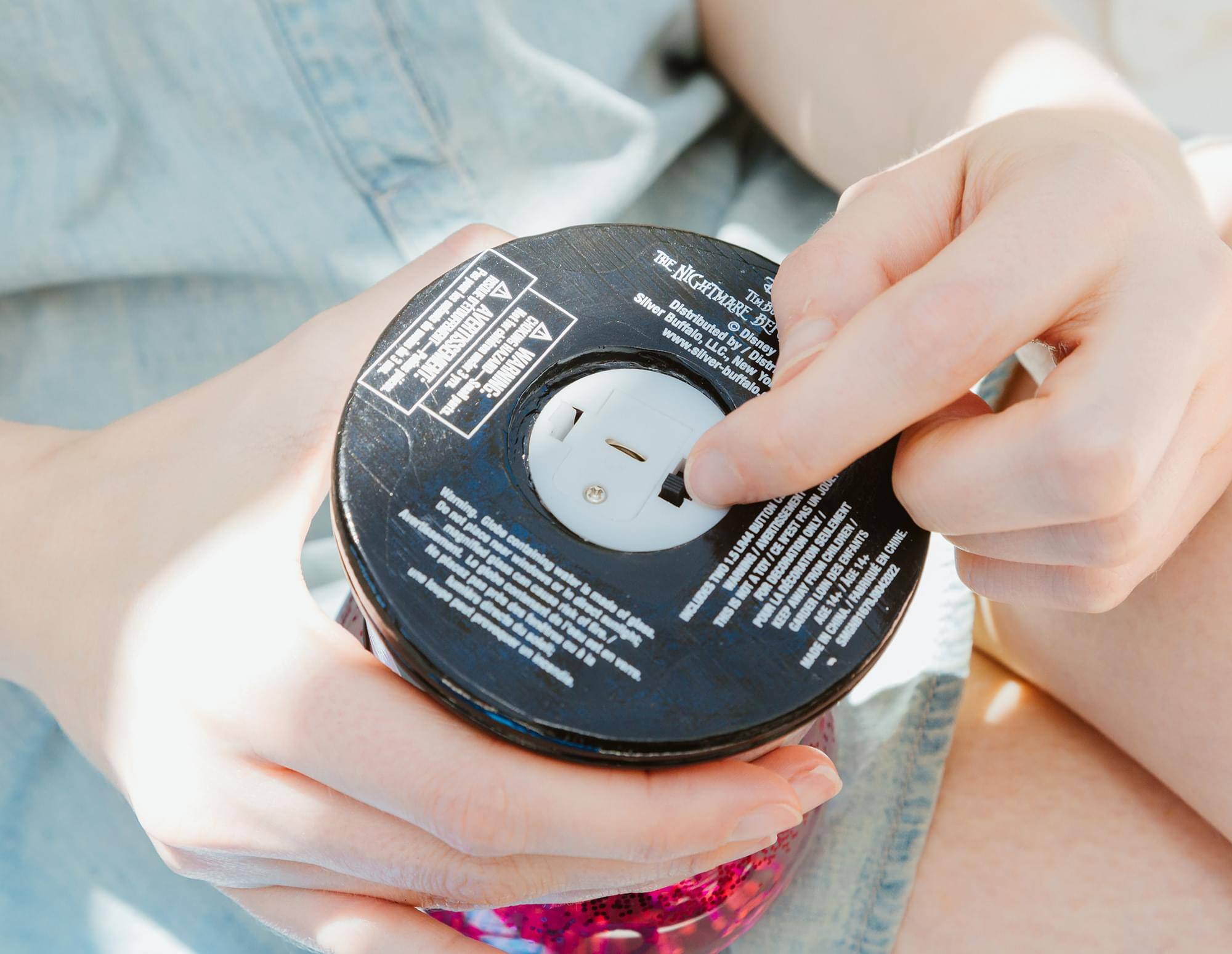 Sure, here is the corrected and grouped text from the image:

---

**THE NIGHTMARE BEFORE CHRISTMAS**

Distributed by Silver Buffalo, LLC. New York, NY
www.silver-buffalo.com

**WARNING: CHOKING HAZARD - Small parts. Not for children under 3 years.**

**AVERTISSEMENT: PÉRIL D'ÉTRANGLEMENT - Petits objets. Ne convient pas aux enfants de moins de 3 ans.**

**WARNING: CHOKING HAZARD - Small parts. Not for children under 3 years.**

**AVERTISSEMENT: PÉRIL D'ÉTRANGLEMENT - Petits objets. Ne convient pas aux enfants de moins de 3 ans.**

**MADE IN CHINA**

**THIS IS NOT A TOY. KEEP AWAY FROM CHILDREN.**

**NE PAS JOUER AVEC. GARDER LOIN DES ENFANTS.**

**WARNING: Do not place near a heat source.**

**AVERTISSEMENT: Ne pas placer près d'une source de chaleur.**

**WARNING: Do not place near a heat source.**

**AVERTISSEMENT: Ne