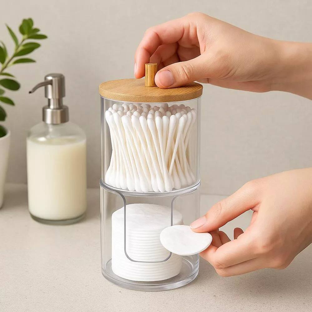 Angle. Elle - Acrylic Q tip Dispenser and Cotton Pad Holder with Bamboo Lid, 2 Tier Nonslip Round Bathroom Organizer Jar - Clear/Natural Bamboo.