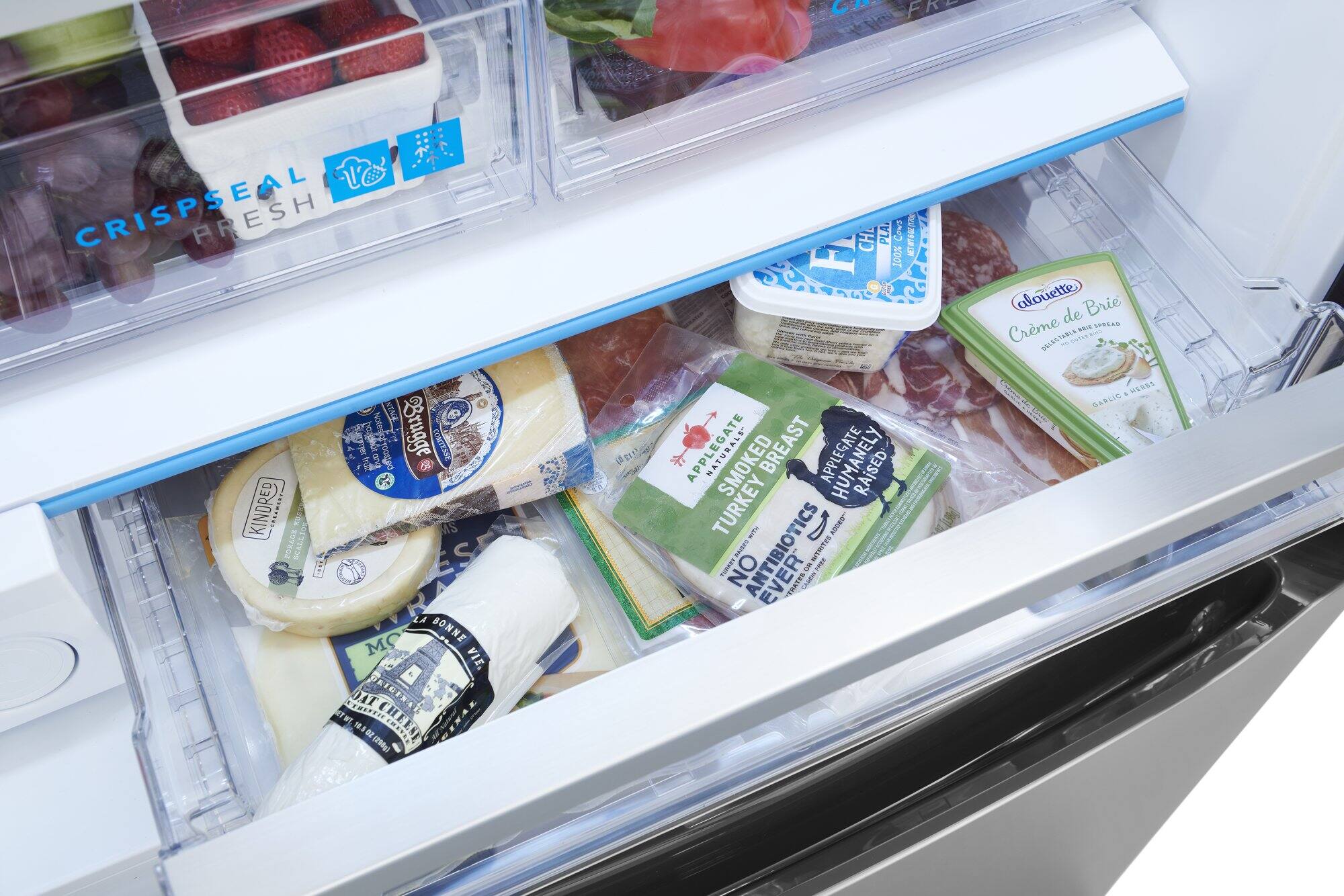 The image shows a refrigerator filled with various food items, including cheese, yogurt, and fruits. The text on the image reads, "Crisp'Seal are fresh menus valur capnut notesig Brugge BUD patoal COMITENSE 2 KINDRED g MS FORAGE SCALLIO S E LA BONNE MO VIE. SEMSTEIE DAT DRIGINAL af TWT HI 18.1 02 (290g) az g) CHEESE OIAL i CH PLA Cows 100% NATURALS- SMOKED BREAST APPLEGATE RAISED TURKEY i D TES VODES... PUPBET NO ES ANTIBIOTICS EVER." This text appears to be a combination of different food items and their descriptions, but it is not organized in a meaningful way.