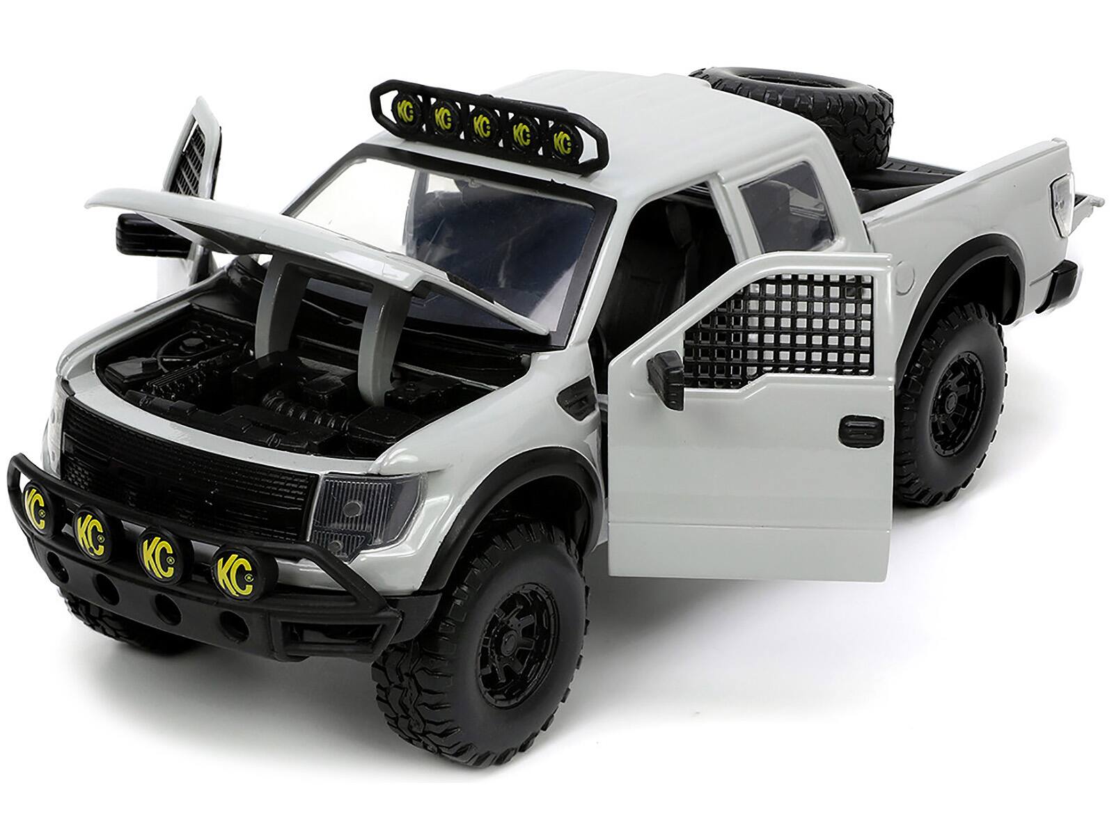 Angle. Jada - 2011 Ford F-150 SVT Raptor Pickup Truck Light Gray with Extra Wheels "Just Trucks" Series 1/24 Diecast Model Car by Jada - Light Gray.