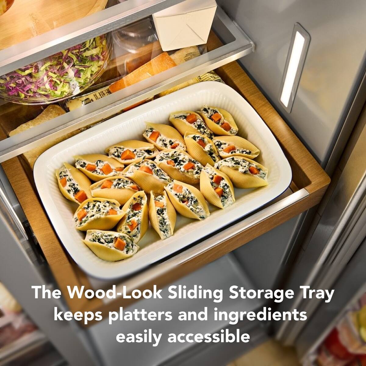 The Wood-Look Sliding Storage Tray keeps platters and ingredients easily accessible
