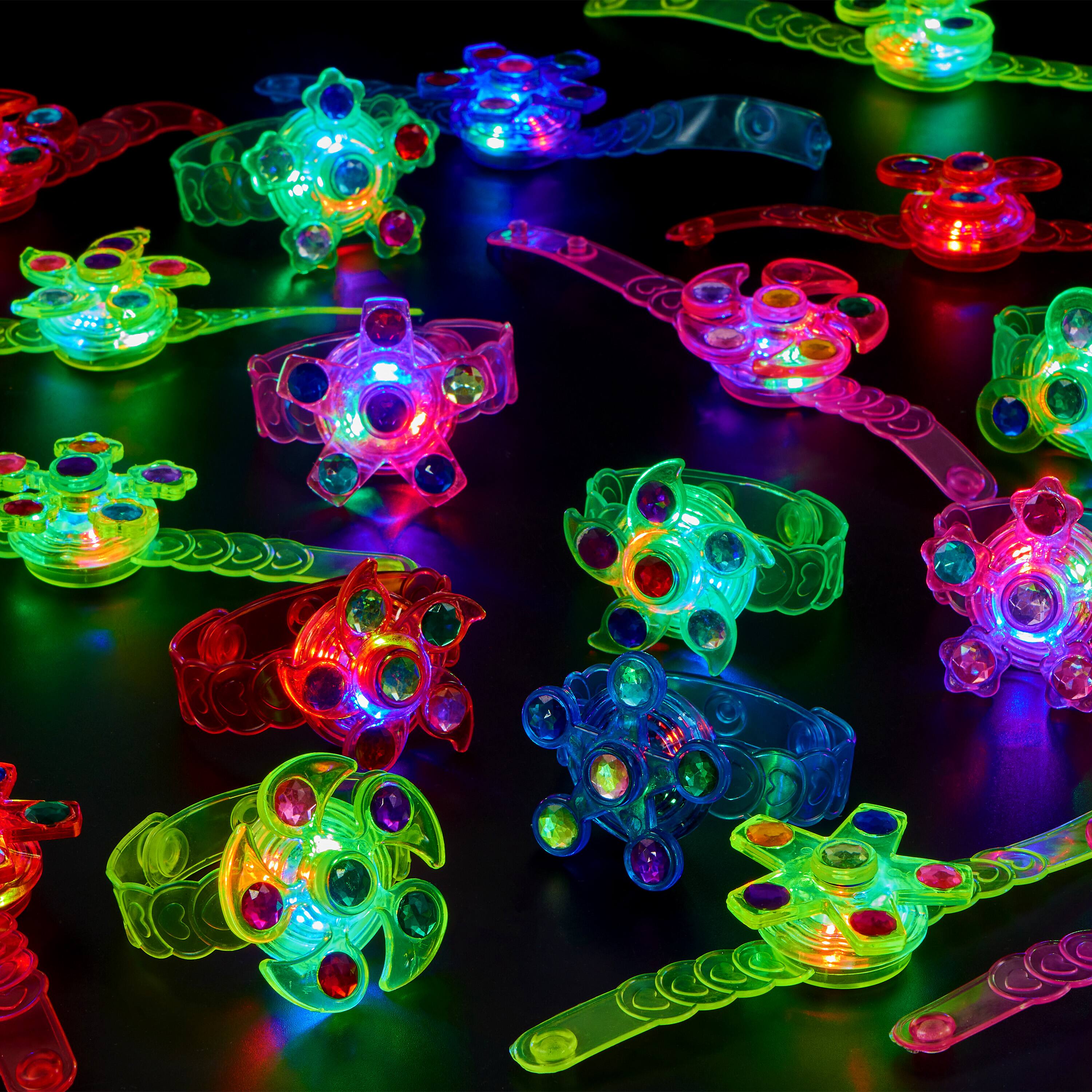 Alt View 5. Joyfy - 24 Pack LED Light Up Fidget Spinner Bracelets, Glow in Dark Party Favors for Kids, School Goodie Bag Stuffers - Multicolor.