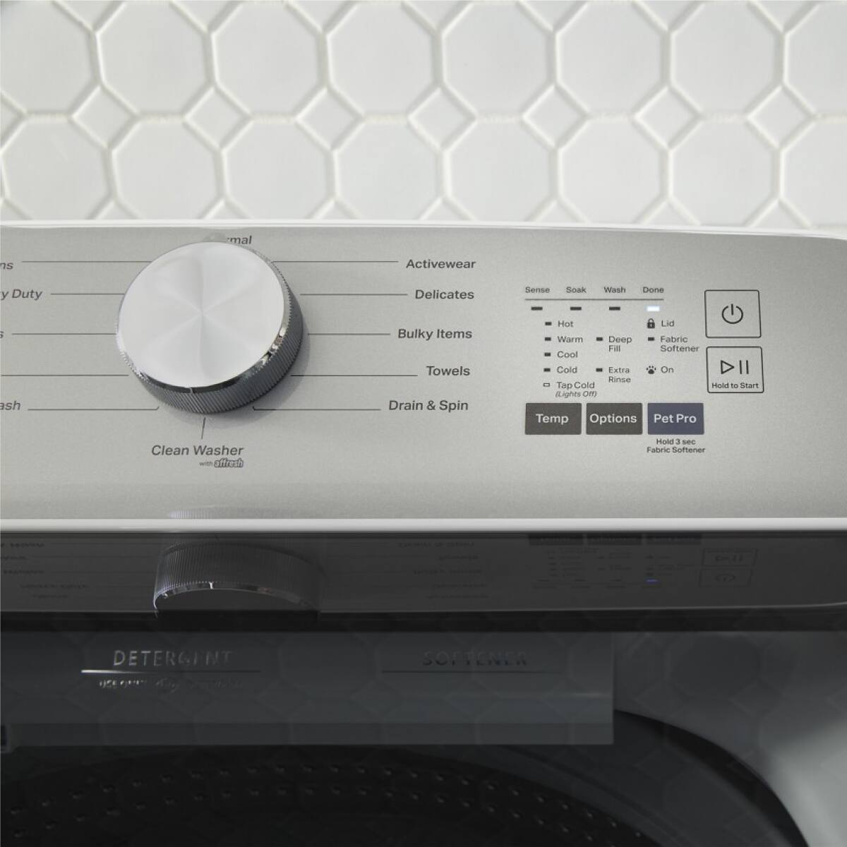 Sure, here is the corrected and grouped text from the image:

---

**Washer Settings:**

- **Activewear**
- **Duty**
- **Delicates**
- **Bulky Items**
- **Towels**
- **Drain & Spin**

**Cycle Options:**

- **Sense**
- **Soak**
- **Wash**
- **Done**

**Temperature:**

- **Hot**
- **Warm**
- **Cold**

**Water Level:**

- **Deep**
- **Fill**
- **Rinse**

**Additional Options:**

- **Fabric Softener**
- **Extra**
- **On**

**Controls:**

- **Temp**
- **Options**
- **Pet Pro**

**Instructions:**

- **Hold to Start**
- **Hold 3 sec Fabric Softener**

**Labels:**

- **Clean Washer with Grate**
- **DETERGENT**
- **SOFTENER**

---