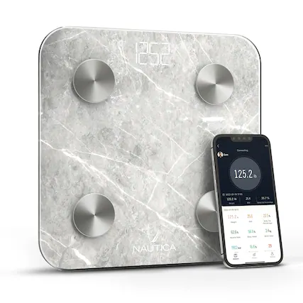 The image features a Nautica scale, which is a weight-loss device. The scale is placed on a marble surface, and a smartphone is positioned next to it. The smartphone displays the user's weight and progress, along with a graph showing the user's weight loss journey. The device is designed to help users track their weight and monitor their progress towards their weight loss goals.