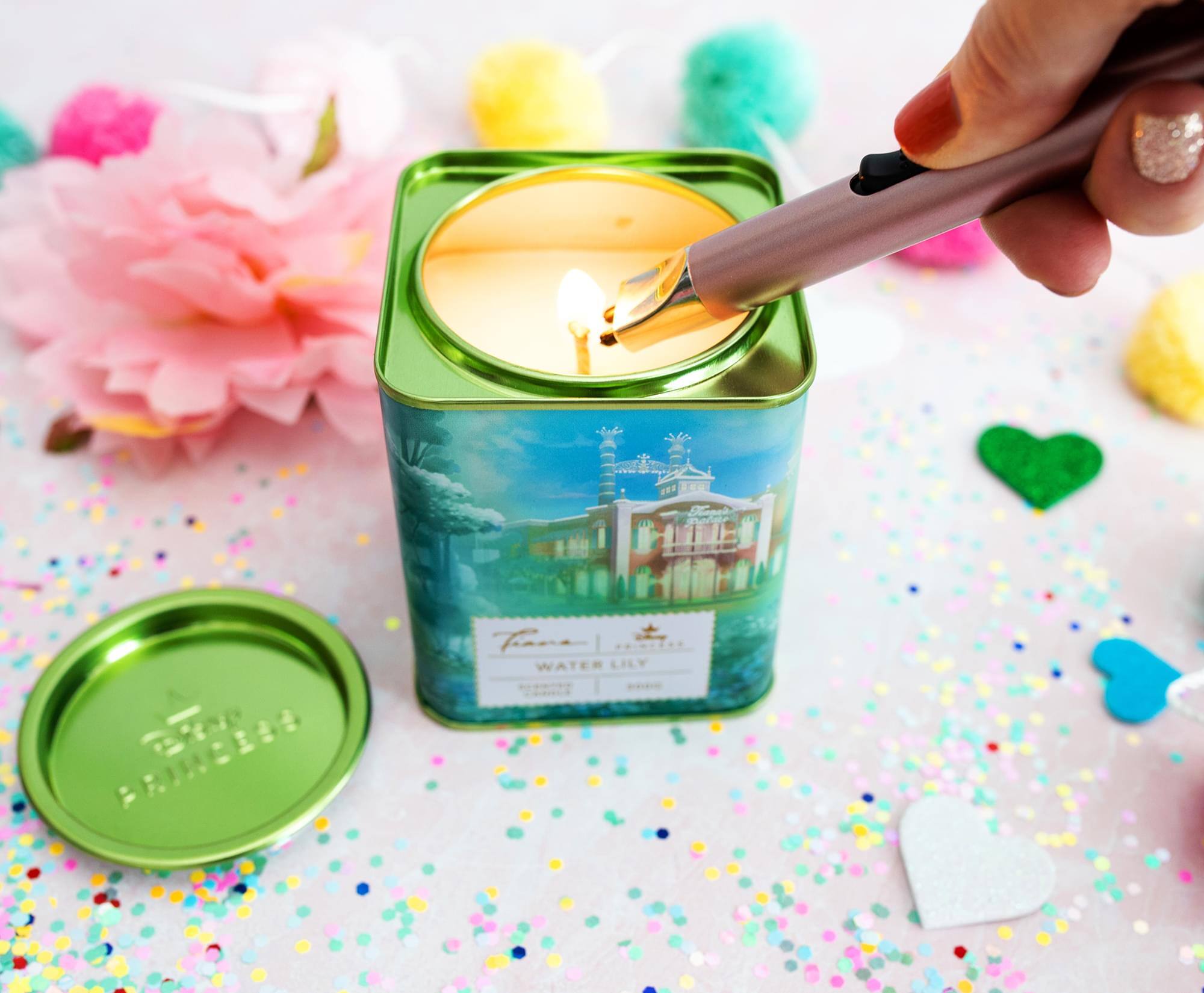 The text on the image reads:

- "Water Lily"
- "Fragrance"
- "Scented Candle"