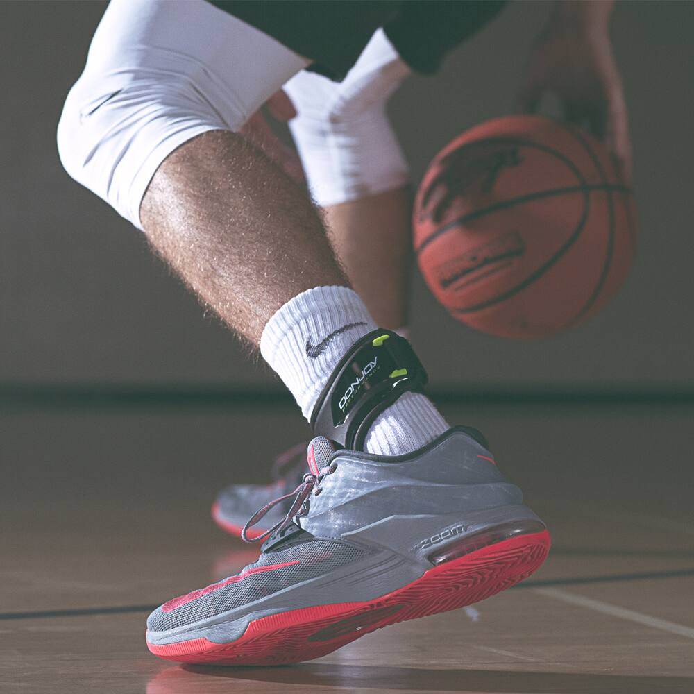 The text on the image reads:

- "KOPNOO ZCOm" (appears to be a misinterpretation or distortion of the text on the shoe)
- "PANUOY" (on the sock)
- "ZOOM" (on the shoe)