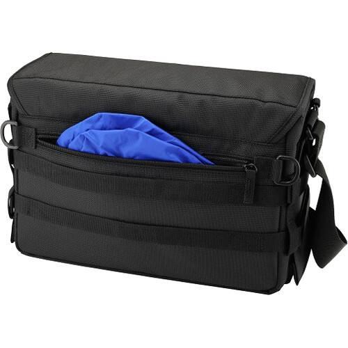 Left. Olympus - Premium Camera System Bag with Padded Dividers, Tablet Pocket, Spacious Storage, and Accessory Organization - Black.