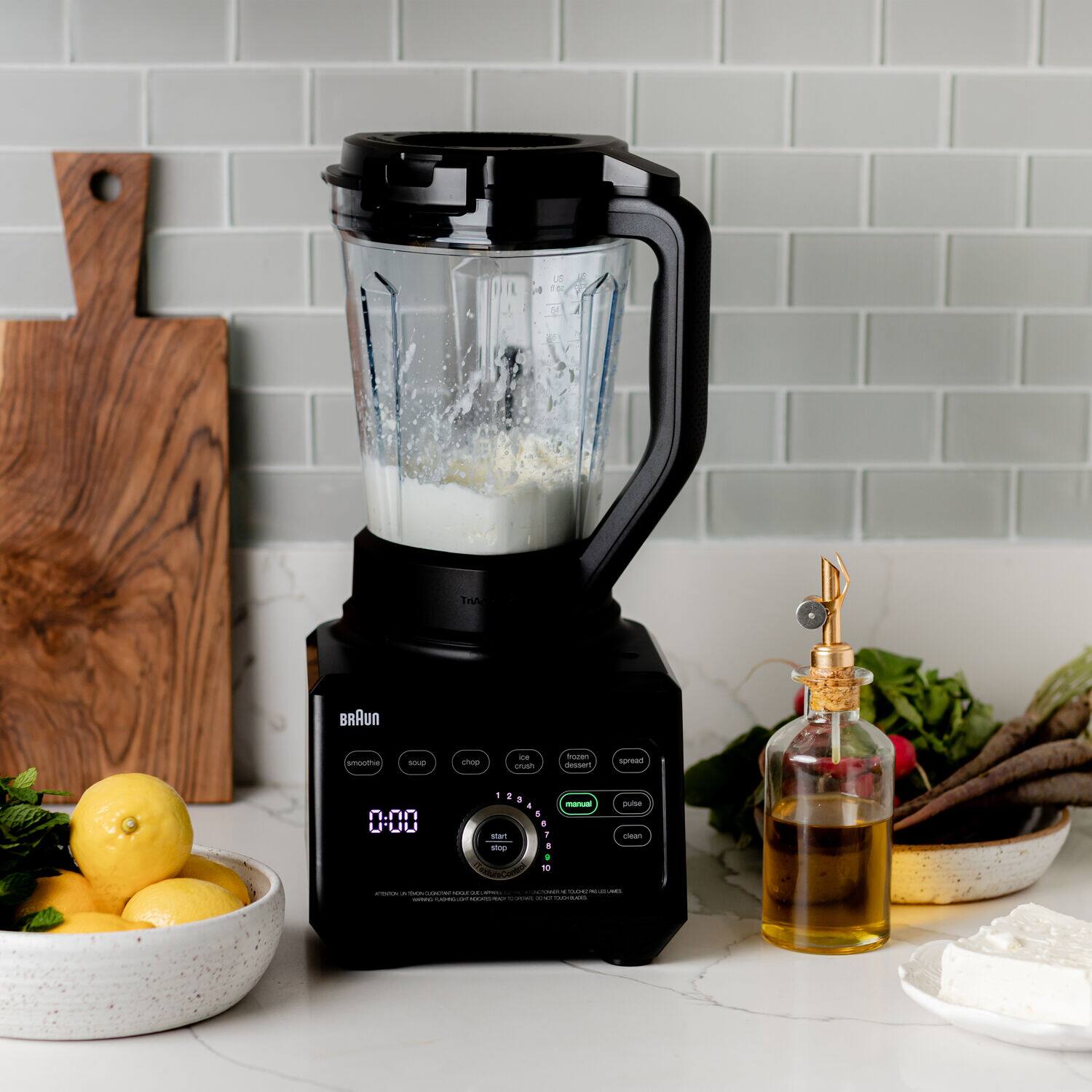 Sure, here is the corrected and grouped text from the image:

---

**BRAUN**

- smoothie
- soup
- chop
- ice crush
- dessert
- spread
- pulse
- clean

**0:00**

**start**

**stop**

---

**Trife BRAUN smote SAD - .- cnueh froen nstan spread 0:00 - sp - sUne can - I - | - : | a | - -. - --  i**

---

The text appears to be a mix of brand information and possibly a scrambled or encoded message. The main focus is on the Braun blender and its functions.