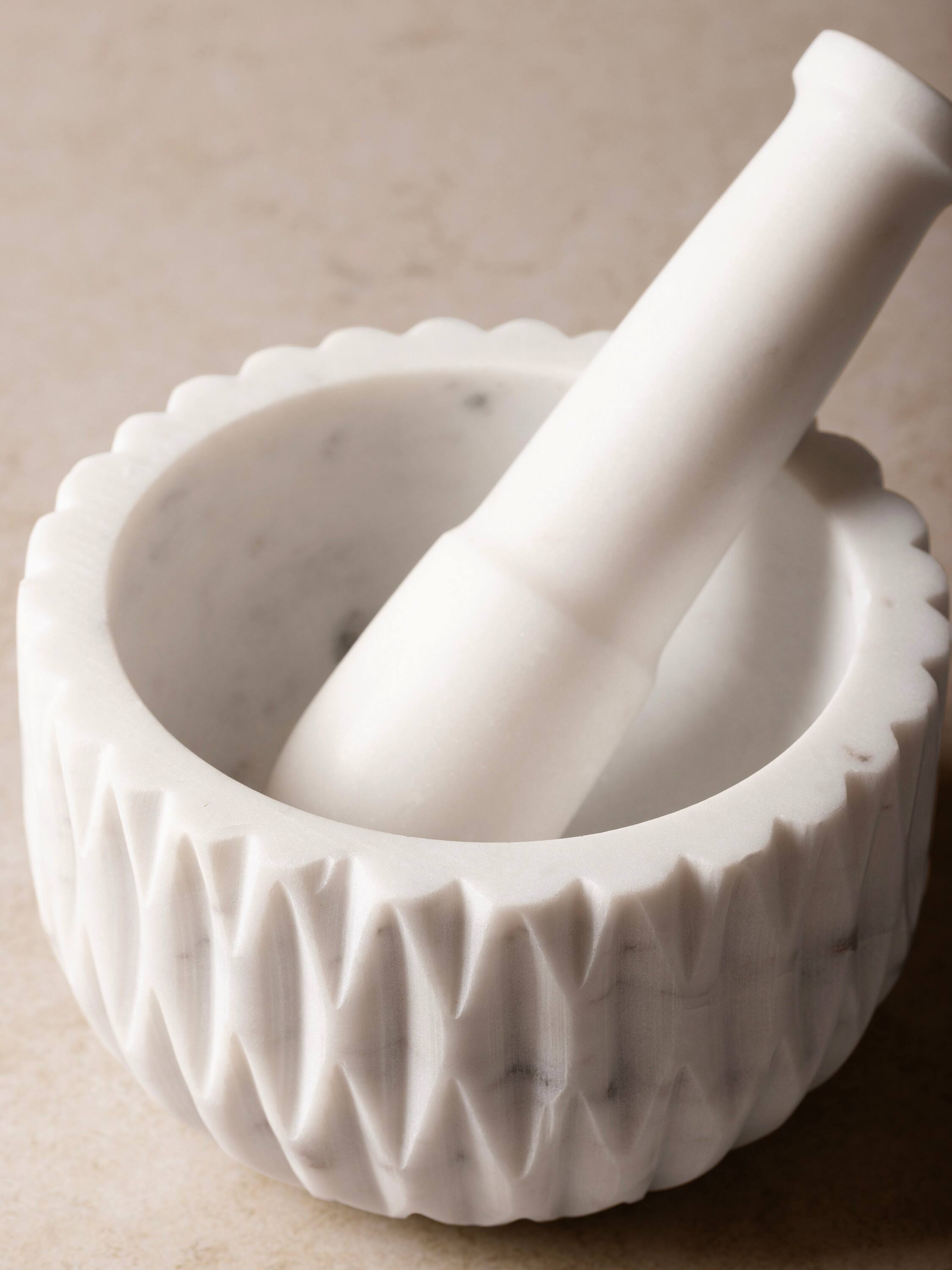 Left. GAURI KOHLI - Russell Mortar and Pestle - Shades of white.