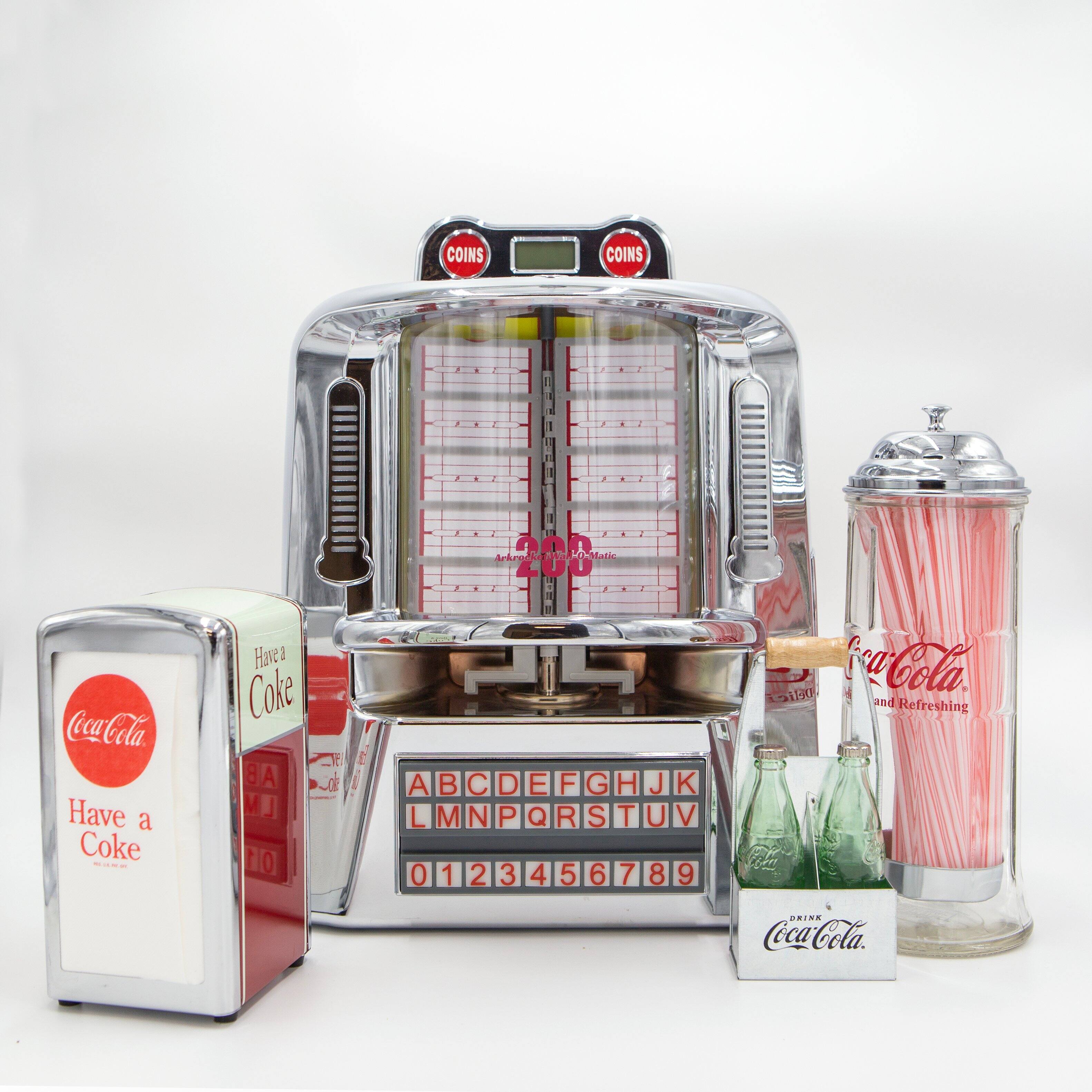 COINS  
COINS  

Antrga rmiootarie  
W Oanie I Coca-Cola  
Have a Coke  

Coca-Cola  
Delicious and Refreshing  

ABCDE FGHIJK  
LMNOPQRSTUV  
0123456789  

Have a Coke  

Coca-Cola  
and Refreshing  

DRINK Coca-Cola