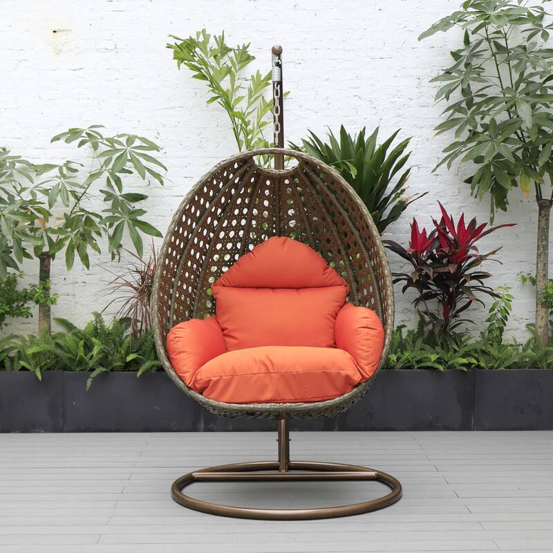 Left. LeisureMod - LeisureMod Beige Wicker Hanging Egg Chair with Iron Stand & Cushion - All-Weather Single Outdoor Patio Swing - Orange.