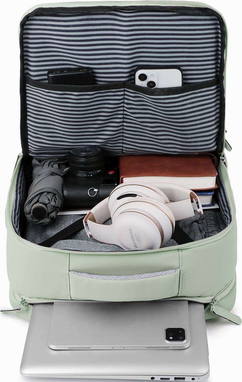 The image shows a striped suitcase filled with various items, including a laptop, a cell phone, a book, and a pair of headphones. The suitcase is open, revealing the contents inside. The laptop is placed on top of the suitcase, while the cell phone is located towards the right side of the suitcase. The book is situated in the middle of the suitcase, and the headphones can be found on the left side. The suitcase is likely being used for travel or storage purposes, and the items inside suggest that the owner may be a student or someone who needs to carry essential electronics and personal belongings.