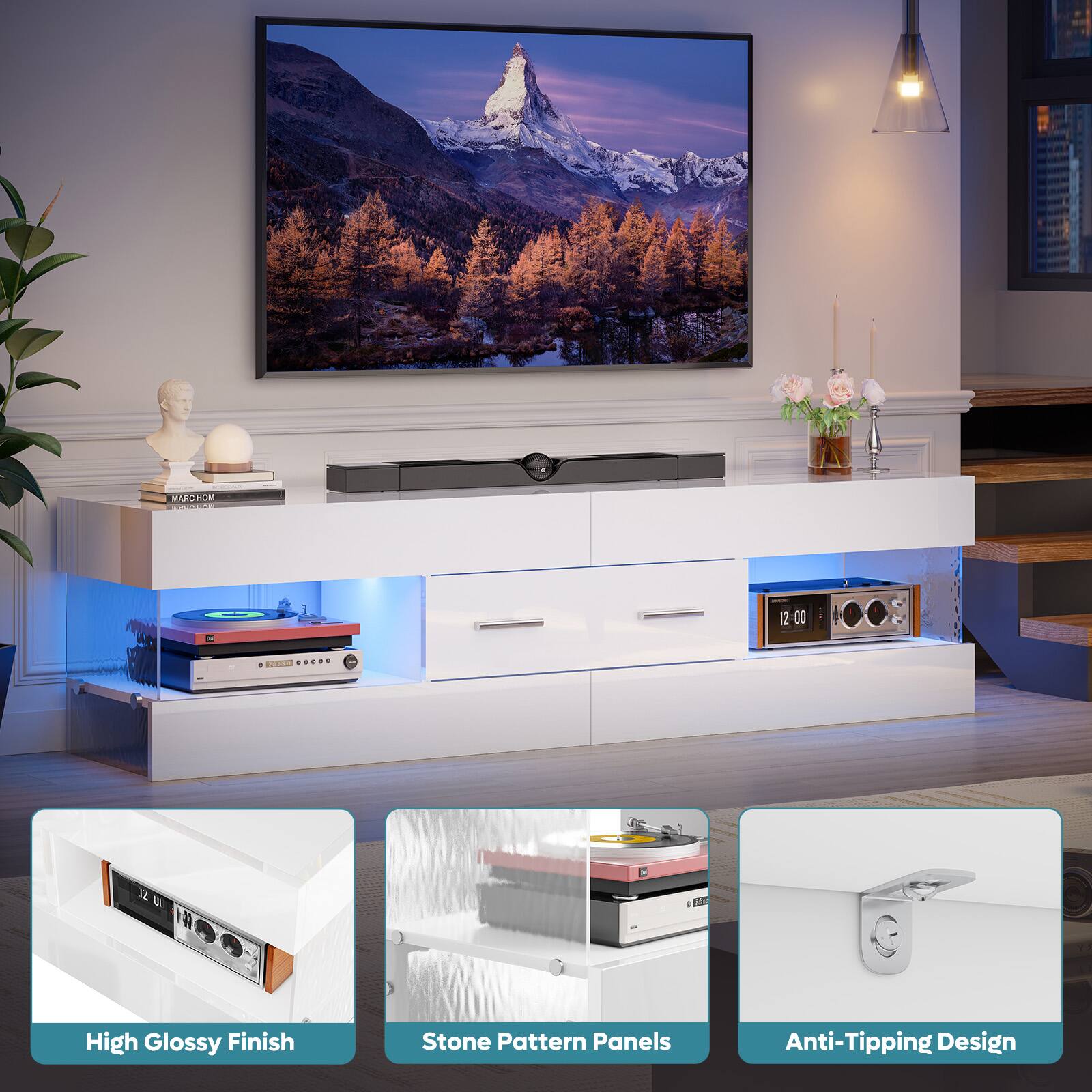 The image features a large flat screen TV mounted on a wall. The TV is surrounded by various items, including a potted plant, a vase, and a couple of books. The TV is placed on a white entertainment center, which has a stone pattern panel design and an anti-tipping design. The entertainment center also has a high glossy finish. The overall scene is well-organized and visually appealing.