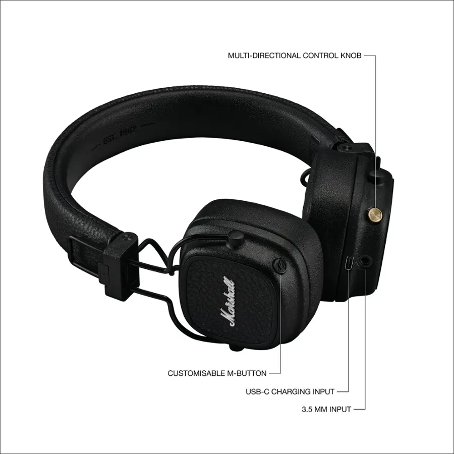 The image features a pair of black headphones with a multi-directional control knob. The headphones are designed by Marshall and have a customizable M-button. They also have a USB-C charging input and a 3.5 mm input. The headphones are compatible with a wide range of devices and offer a comfortable listening experience.