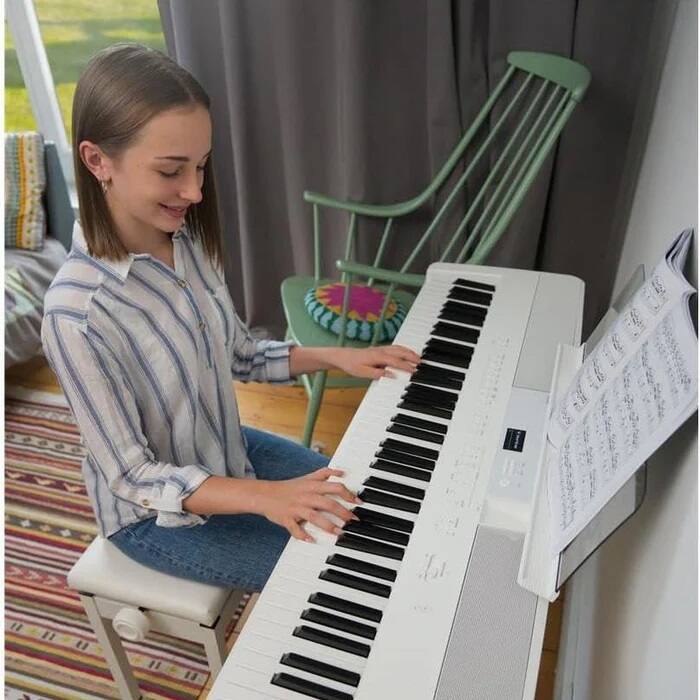 Left. Kawai Pianos - ES520 88-Key Digital Piano with Responsive Hammer Compact II Action | Built-in Bluetooth and Integrated Lesson Books - Snow White.