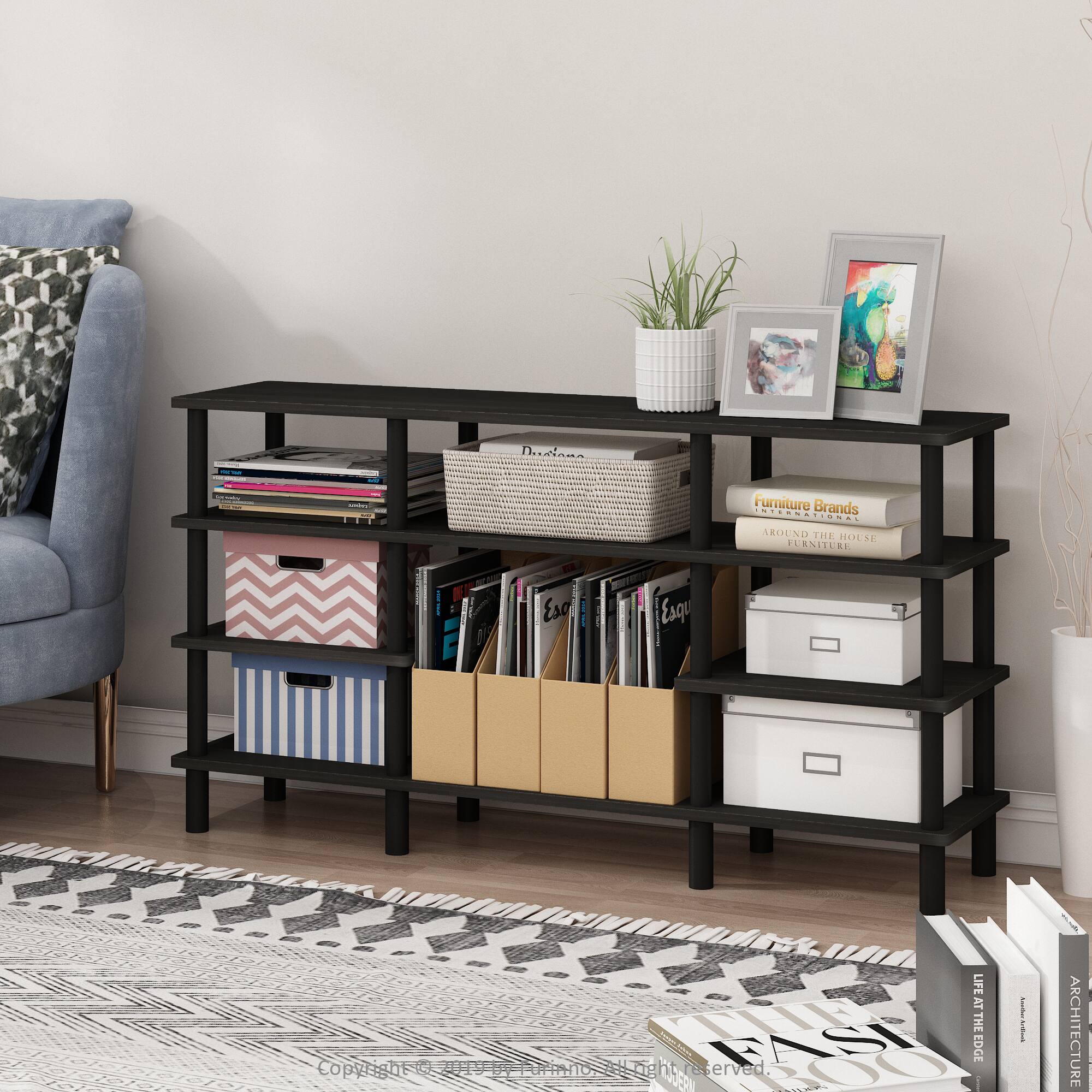 Sure, here is the corrected and grouped text from the image:

---

**Top Shelf:**
- (Image of a plant and framed pictures)

**Second Shelf:**
- (Books and magazines)

**Third Shelf:**
- (Books and magazines)

**Fourth Shelf:**
- (Books and magazines)

**Fifth Shelf:**
- (Books and magazines)

**Books and Magazines:**
- "Furniture Brands International"
- "AROUND THE HOUSE"
- "LIFE AT THE EDGE"
- "ARCHITECTURE"
- "LIFE AT THE EDGE"
- "ARCHITECTURE"

**Copyright:**
- "Copyright © 2019 by [Name]"

---

This text is organized based on the visible items and their placement in the image.