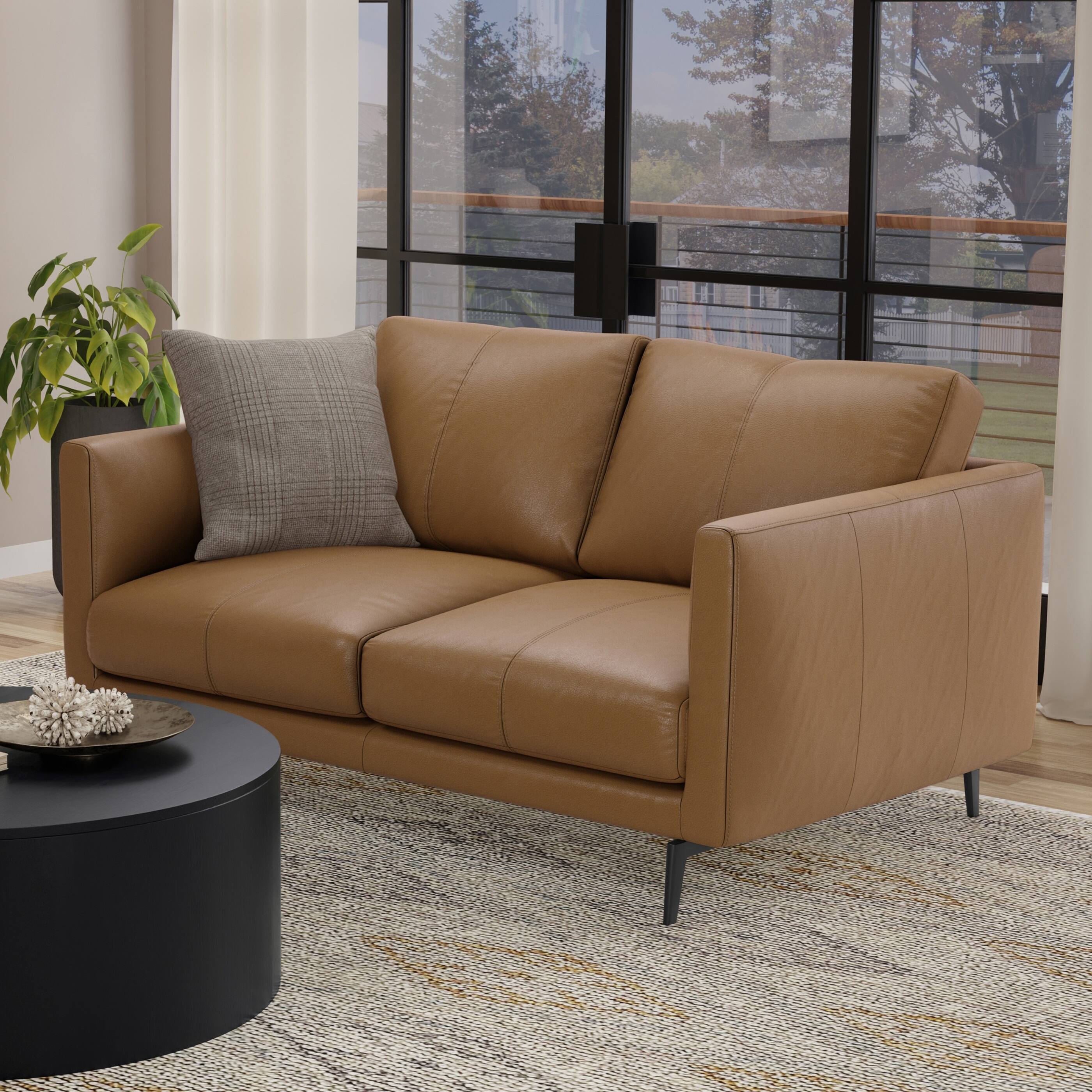 Angle. Simpli Home - Stevens Mid-Century Modern 60 inch Wide Sofa in Butternut Brown Genuine Leather - Butternut Brown.