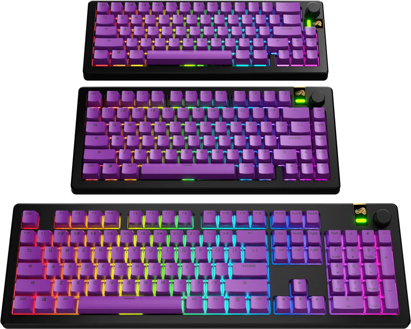 The image shows three different colored keyboards, each with a unique color scheme. The first keyboard has a purple and yellow color scheme, the second keyboard has a purple and blue color scheme, and the third keyboard has a purple and red color scheme. The keyboards are arranged in a way that allows the viewer to see the entirety of each keyboard.