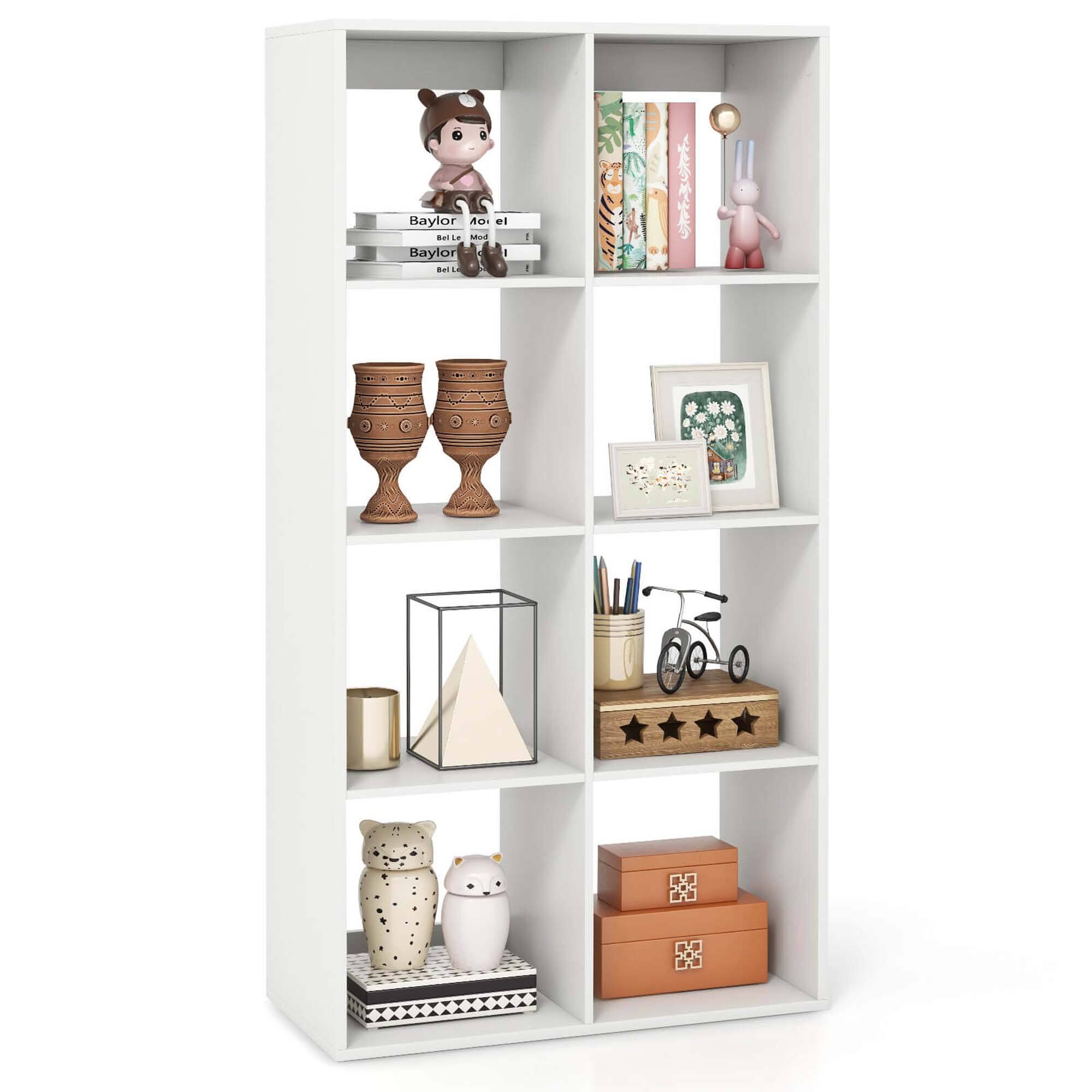 The image features a white bookshelf with various items on it. There are several books placed on different shelves, along with a teddy bear, a vase, a pair of scissors, and a pair of glasses. The bookshelf is filled with a mix of decorative and functional items, creating a visually appealing and organized space.