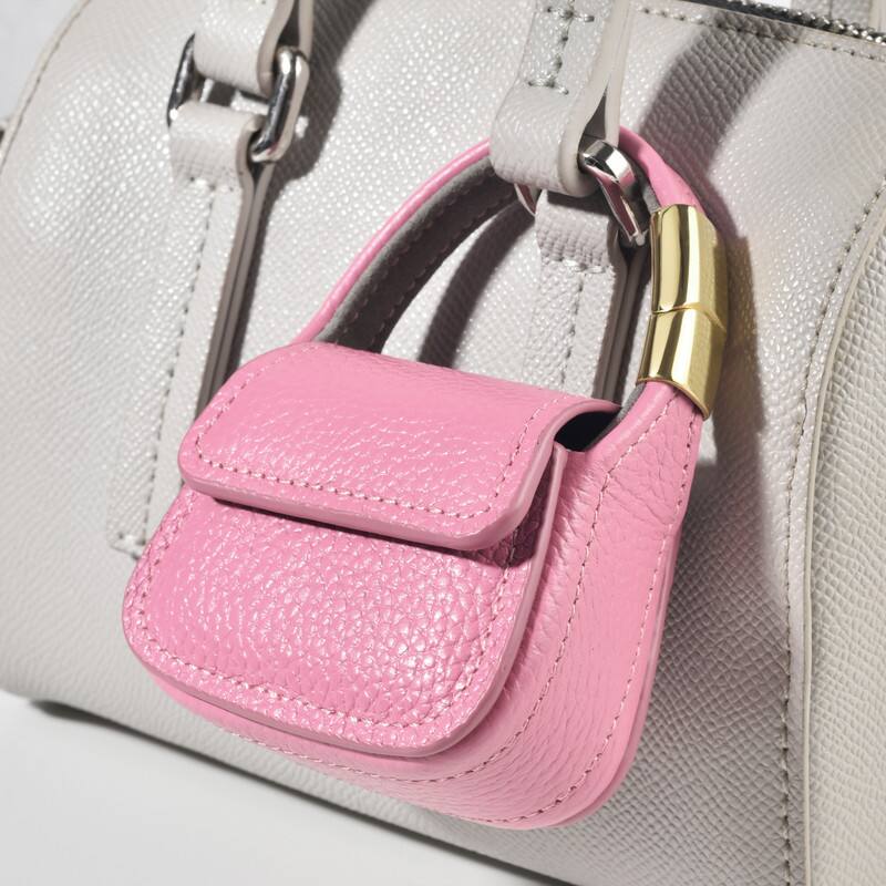 Alt View 4. Posh Tech - Mini Purse Charm for Airpods Pro®.