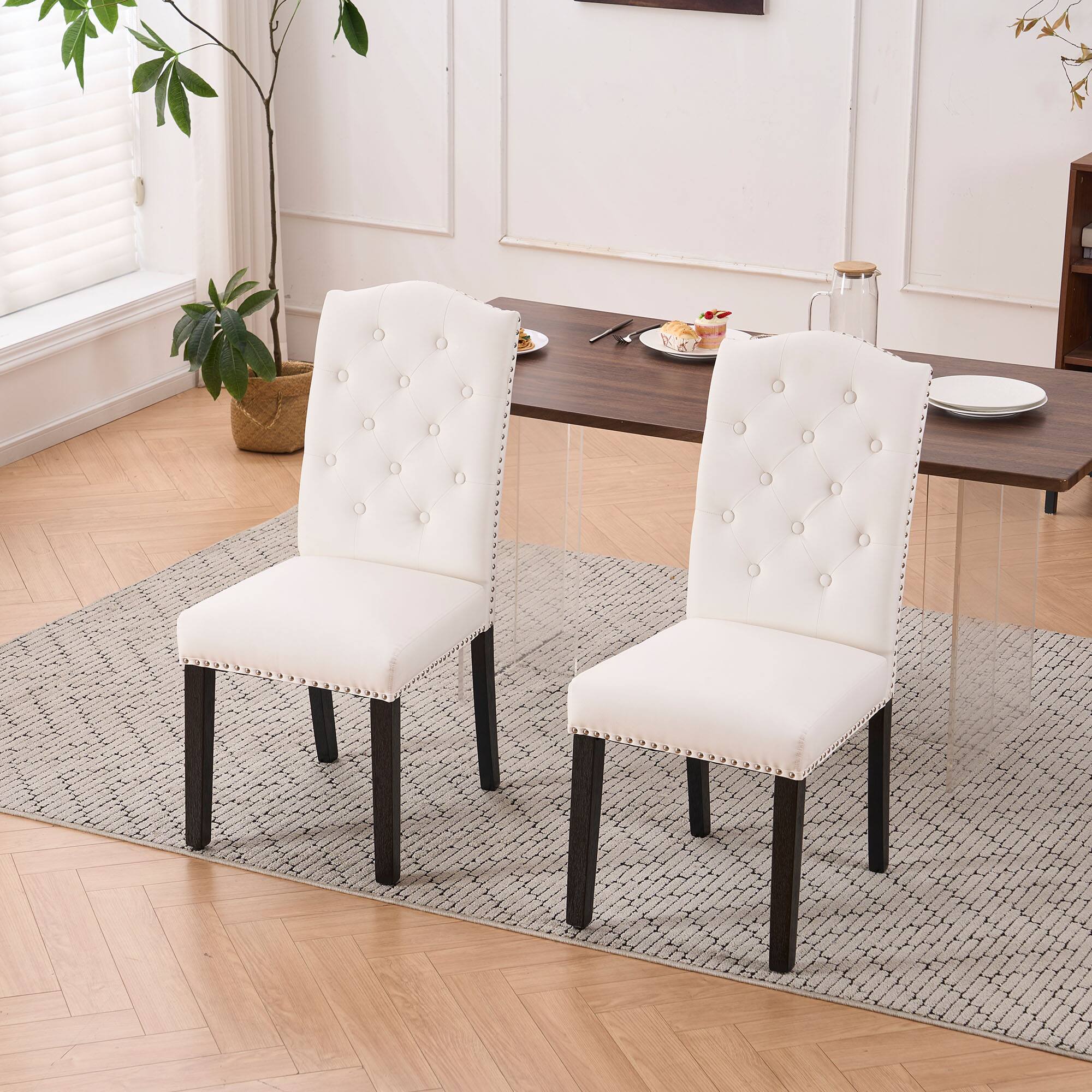 Left. FERPIT - FERPIT Set of 2 Upholstery Faux Leather Dining Chairs with Button Tufted High Back and Nailhead Trim, Beige - Beige.