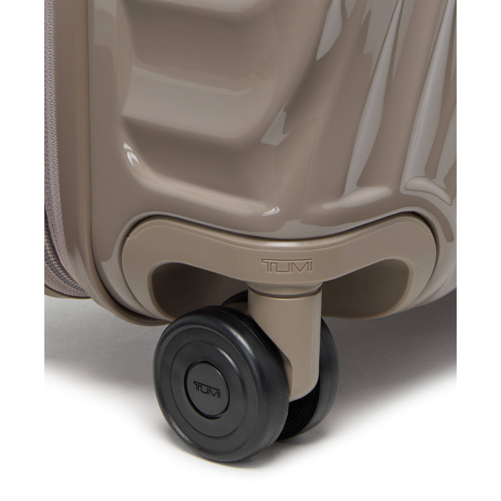 The text on the image is "TUMI."