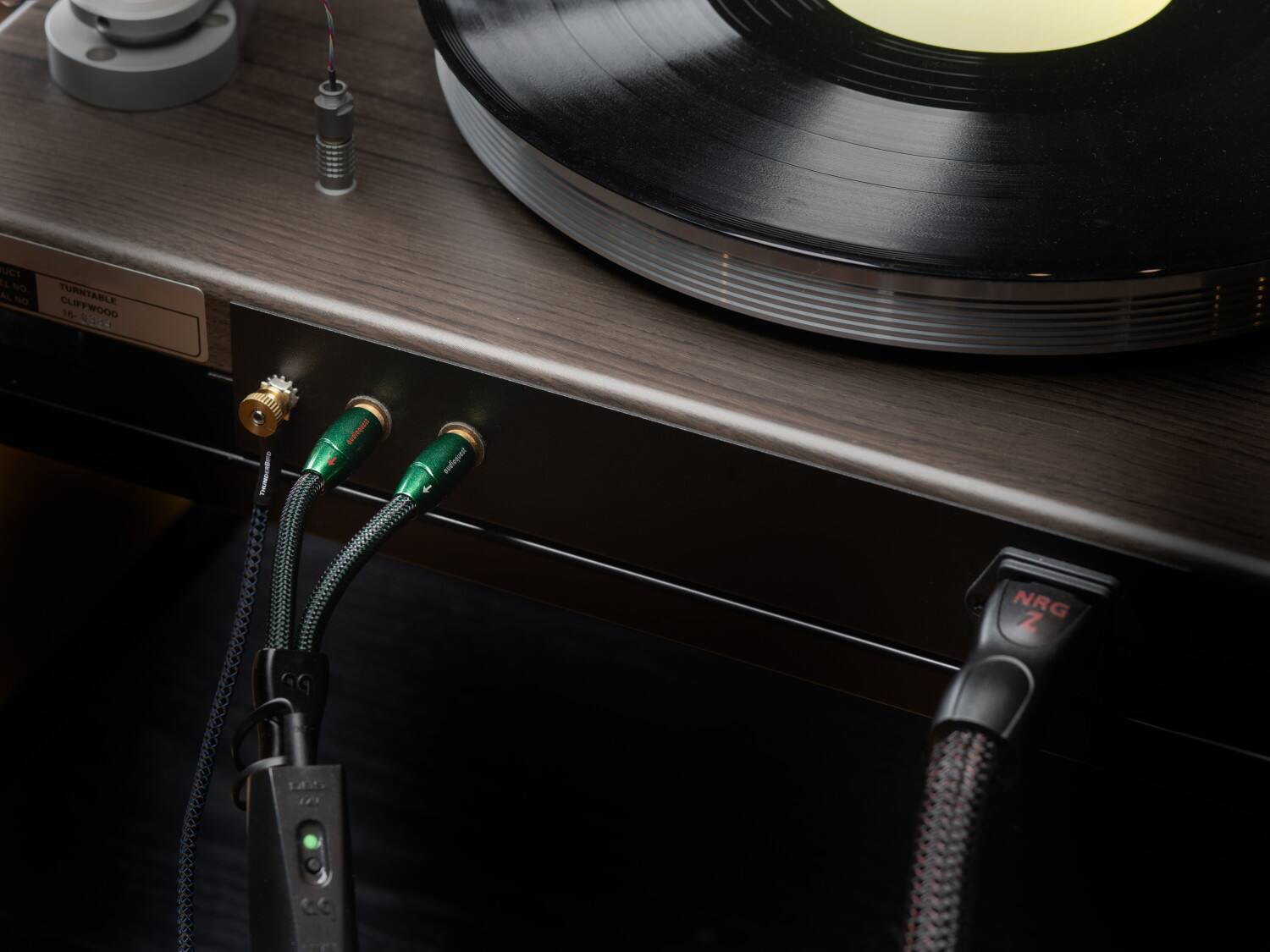 The text on the image reads "RICT IL NO AL NO TURNTABLE CLIFFWOOD 16 0324 h dqd NRG Z." This text is likely a combination of random letters and numbers without any coherent meaning.