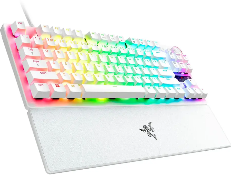 The image shows a white keyboard with a rainbow-colored design. The keyboard has a total of 19 keys, including letters, numbers, and function keys. The keys are arranged in two rows, with the top row containing the letters A to Z and the bottom row containing the numbers 1 to 9, along with other function keys. The keyboard also features a space bar and a shift key. The unique design of the keyboard makes it stand out and adds a touch of color to the workspace.